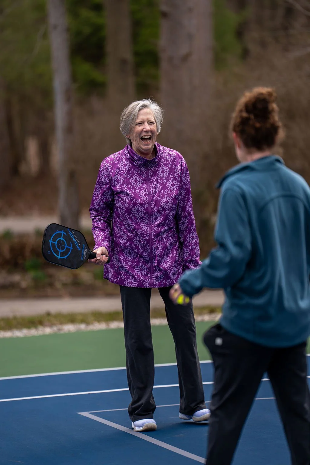 playing pickleball on the onsite court