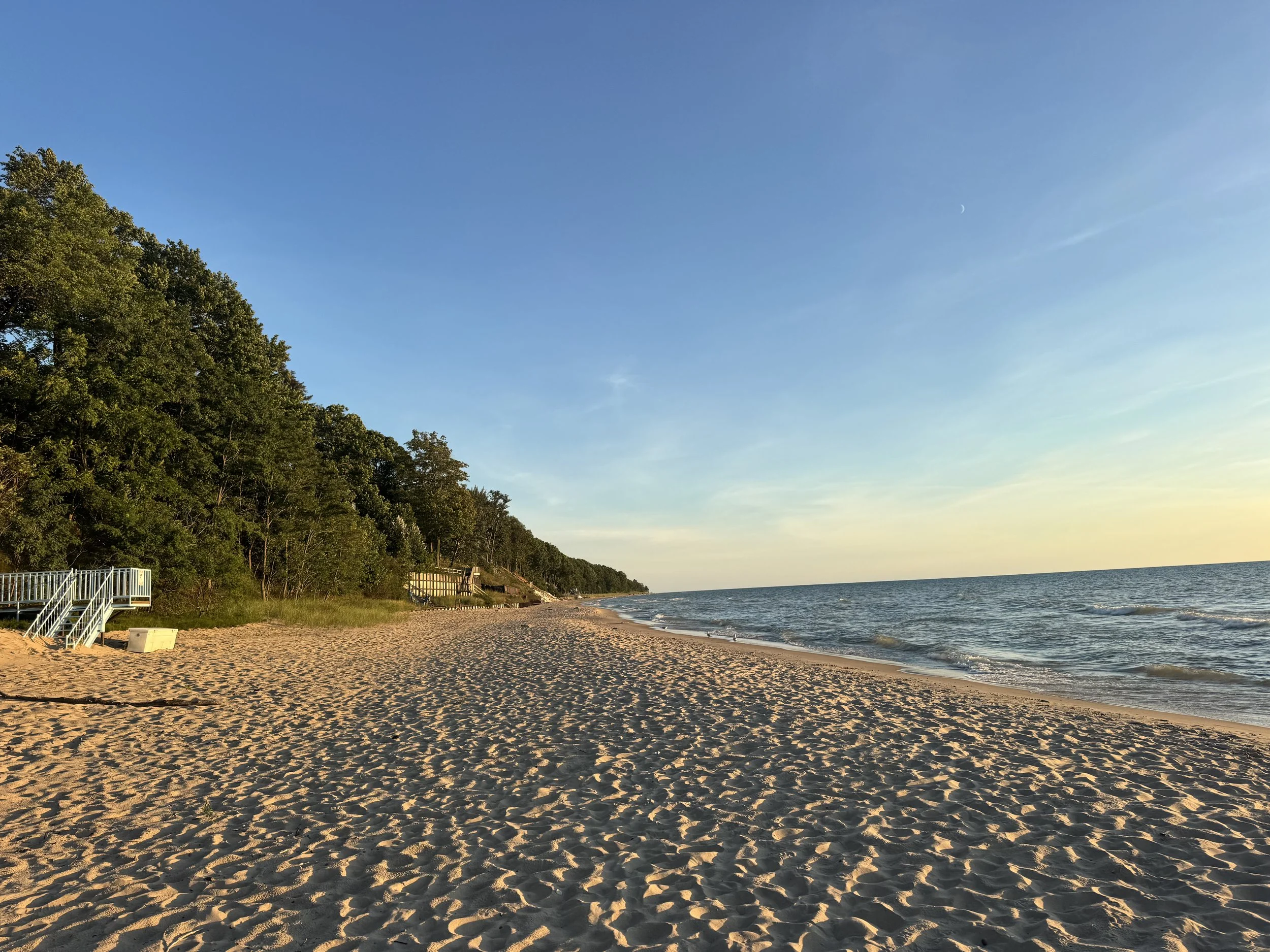 soft sunshine illuminates the shores of lake Michigan