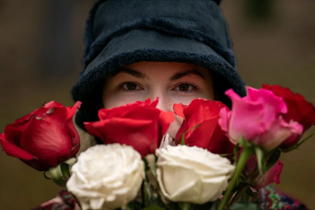 wild woman looks through the roses