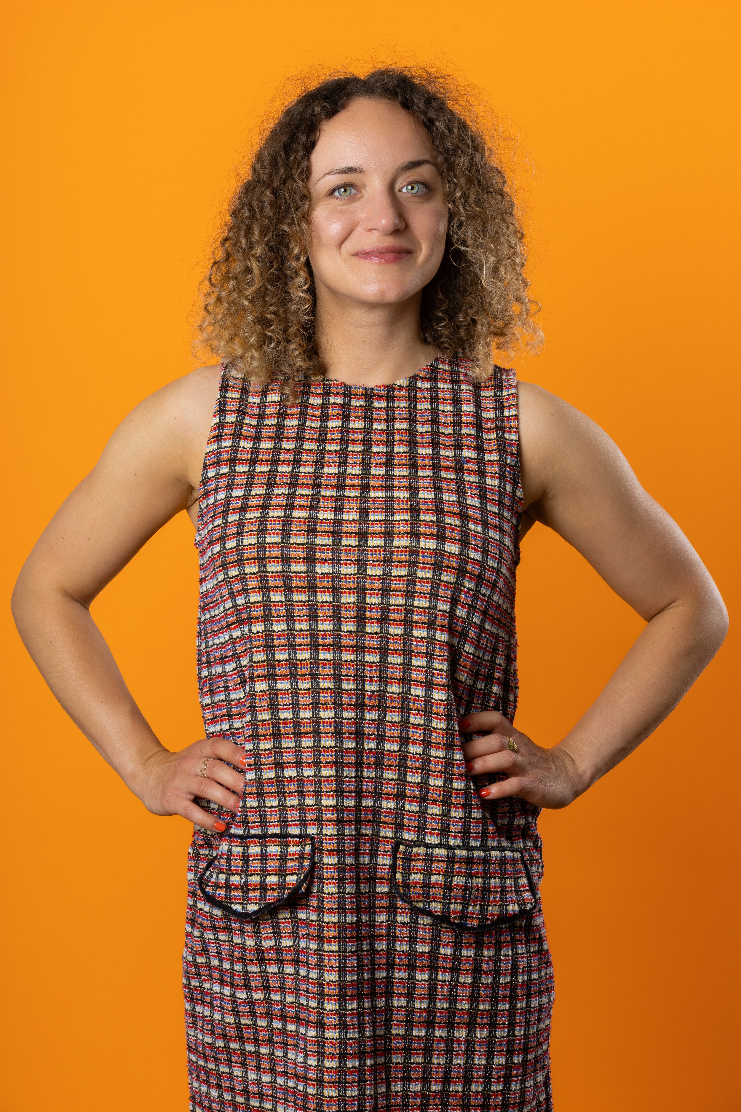 Beautiful vibrant woman in power pose photographed by Brighton and Hove photography photographer