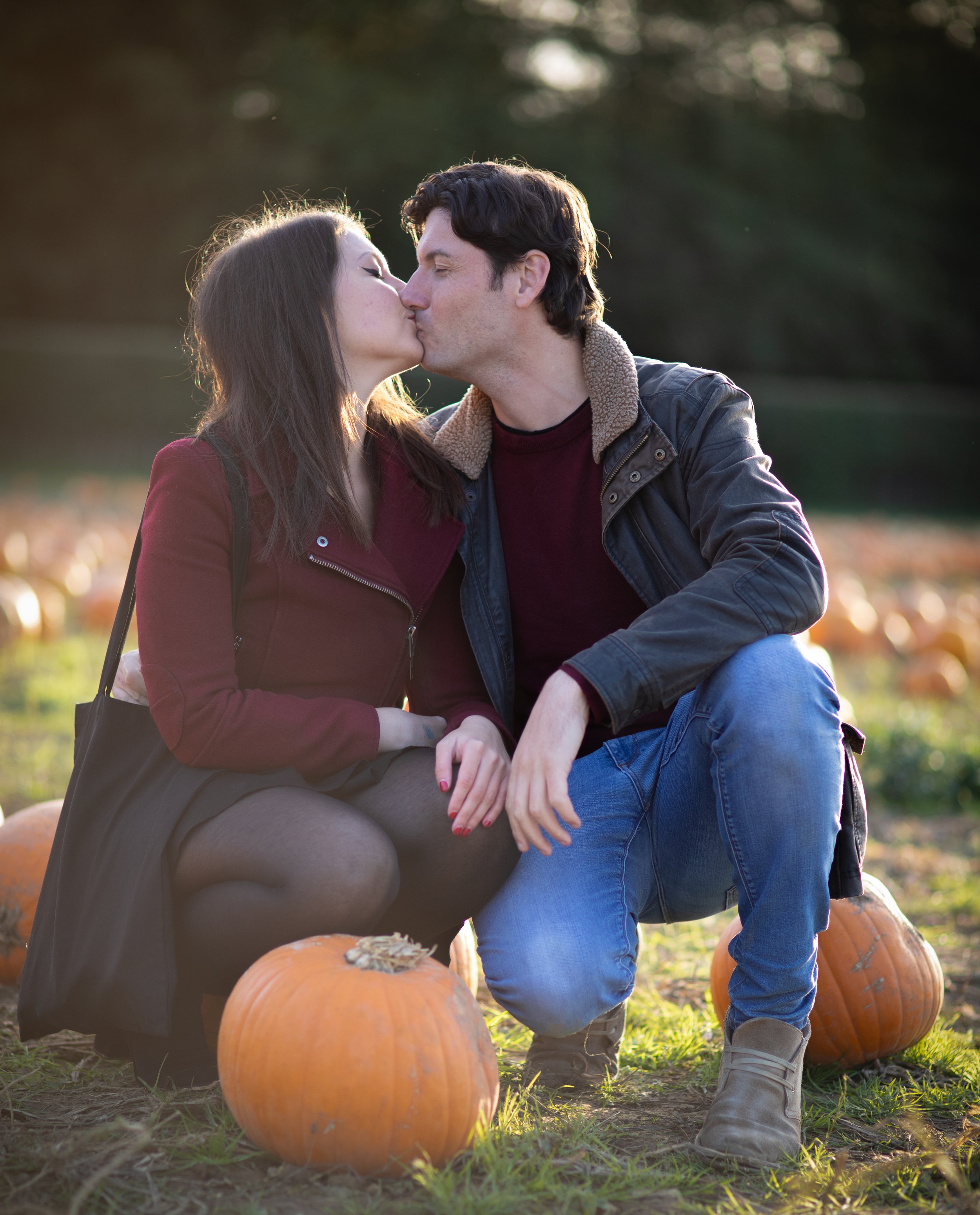 Autumn couple photography with pumpkins