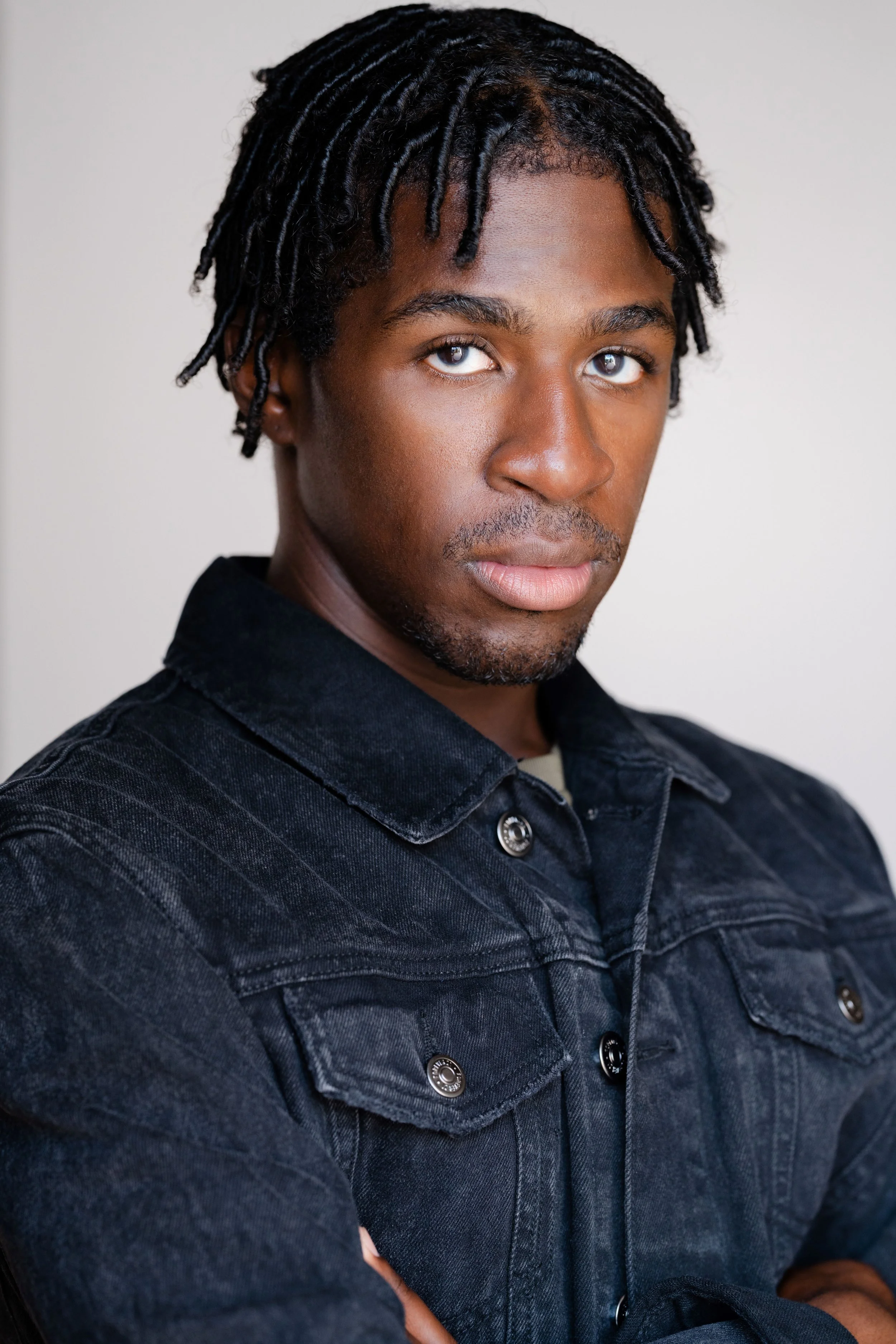 Jacket Glare Headshot squarespace.jpg