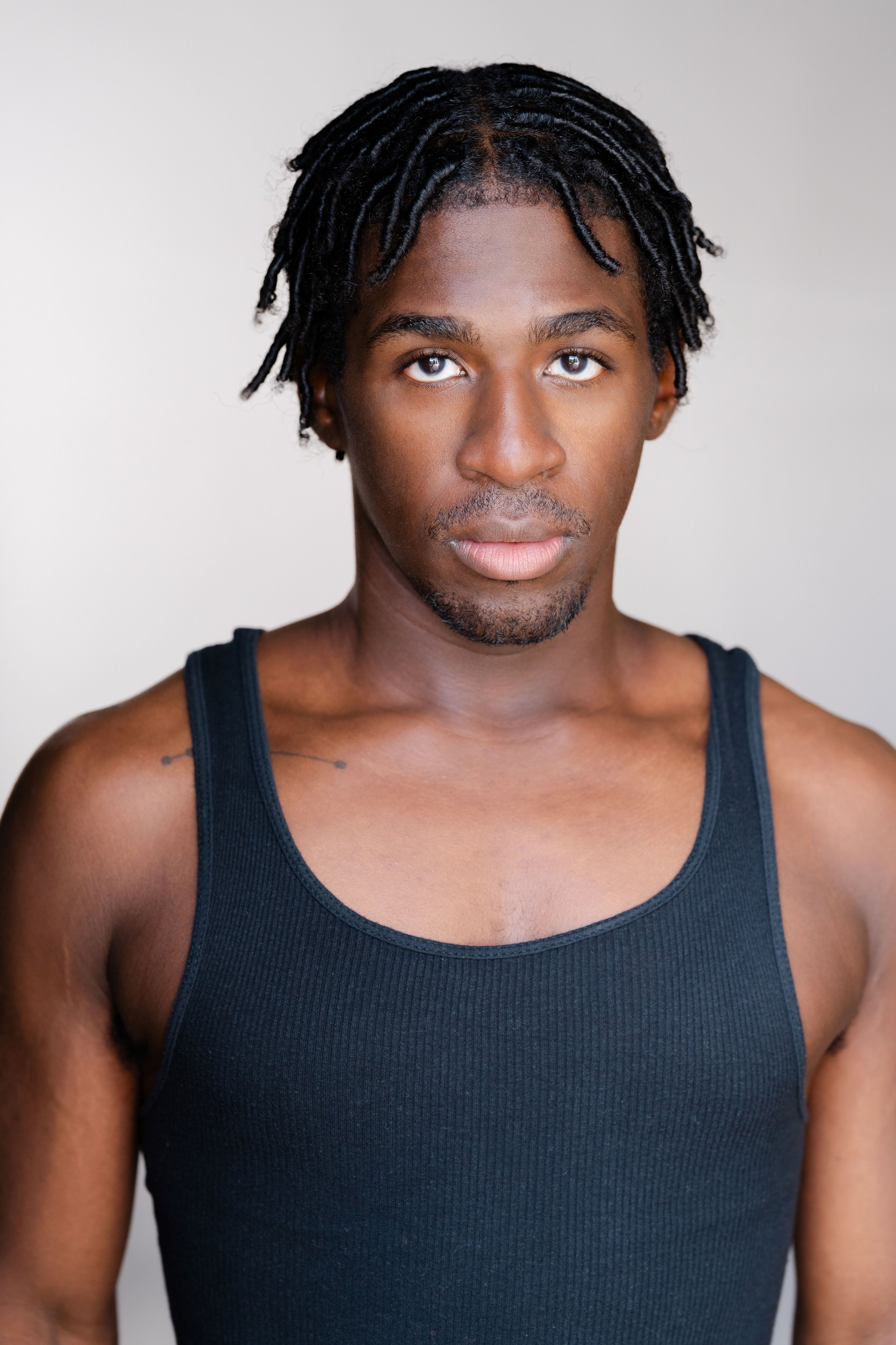 Tank Top Glare Headshot squarespace.jpg