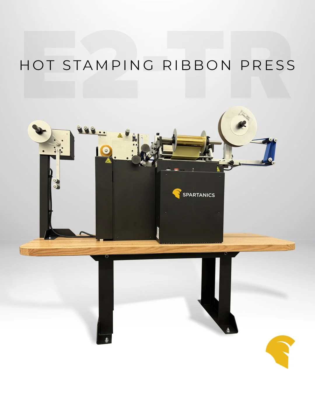 The Malahide by Spartanics E2-TR Ribbon Press is a fully automatic, multi-color Ribbon Printing System.

Offering fully automatic print, pull, cut, and rewind functions, the E2-TR is commonly used to hot-stamp award ribbons, rosette components, and c