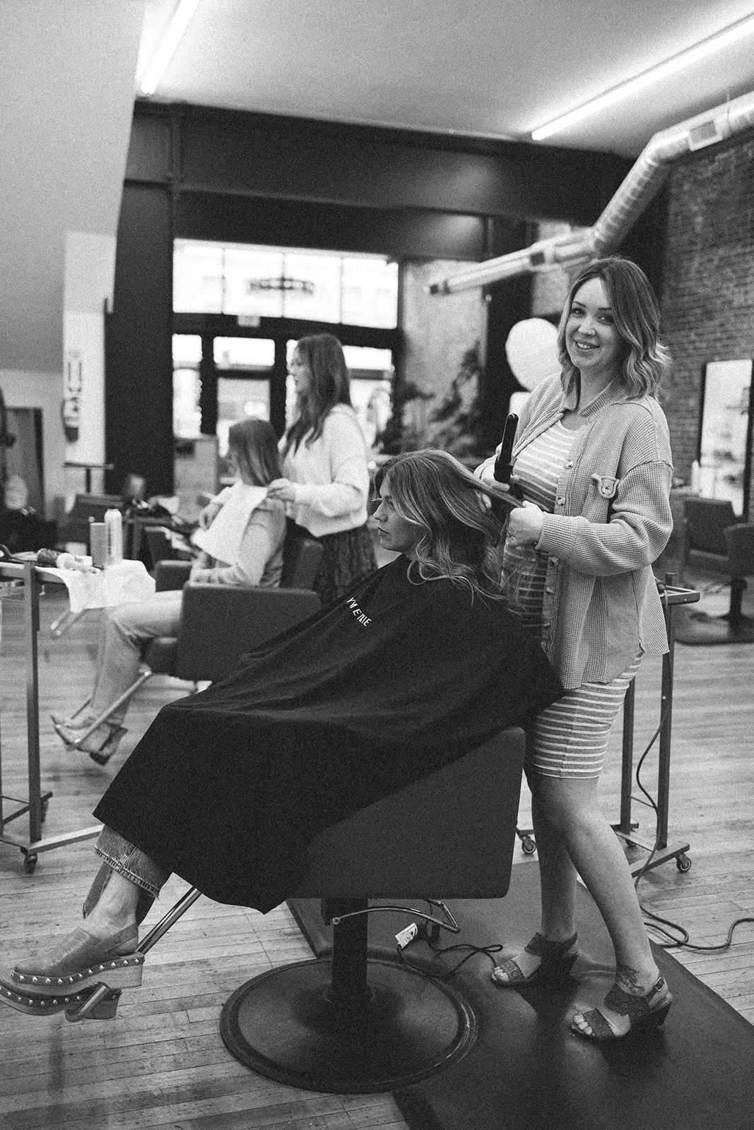 Paige McDowell styling a client's hair in her Lynden, Washington salon