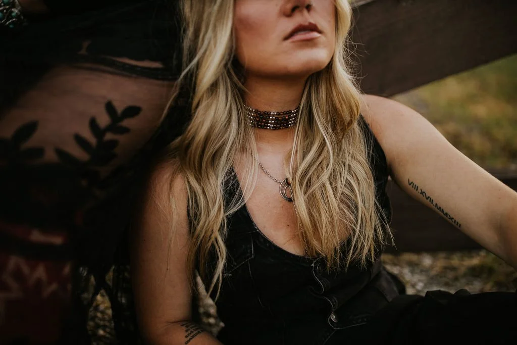 Woman with long lived-in blonde hair photographed outdoors in Lynden, Washington