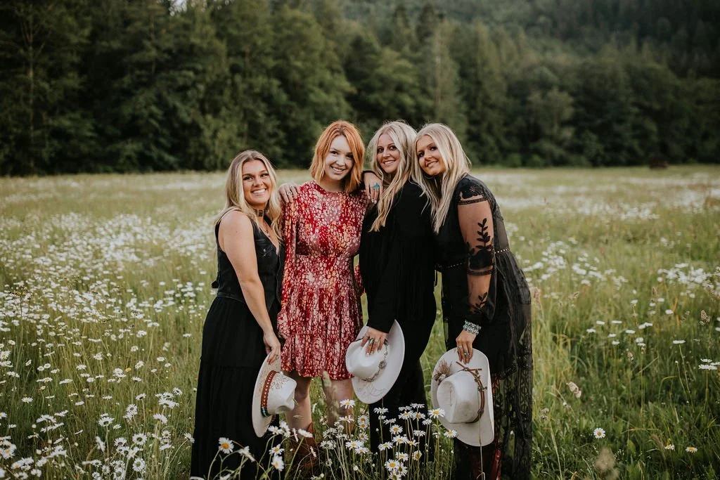 Group of women spending time together in a wildflower field in Lynden, Washington