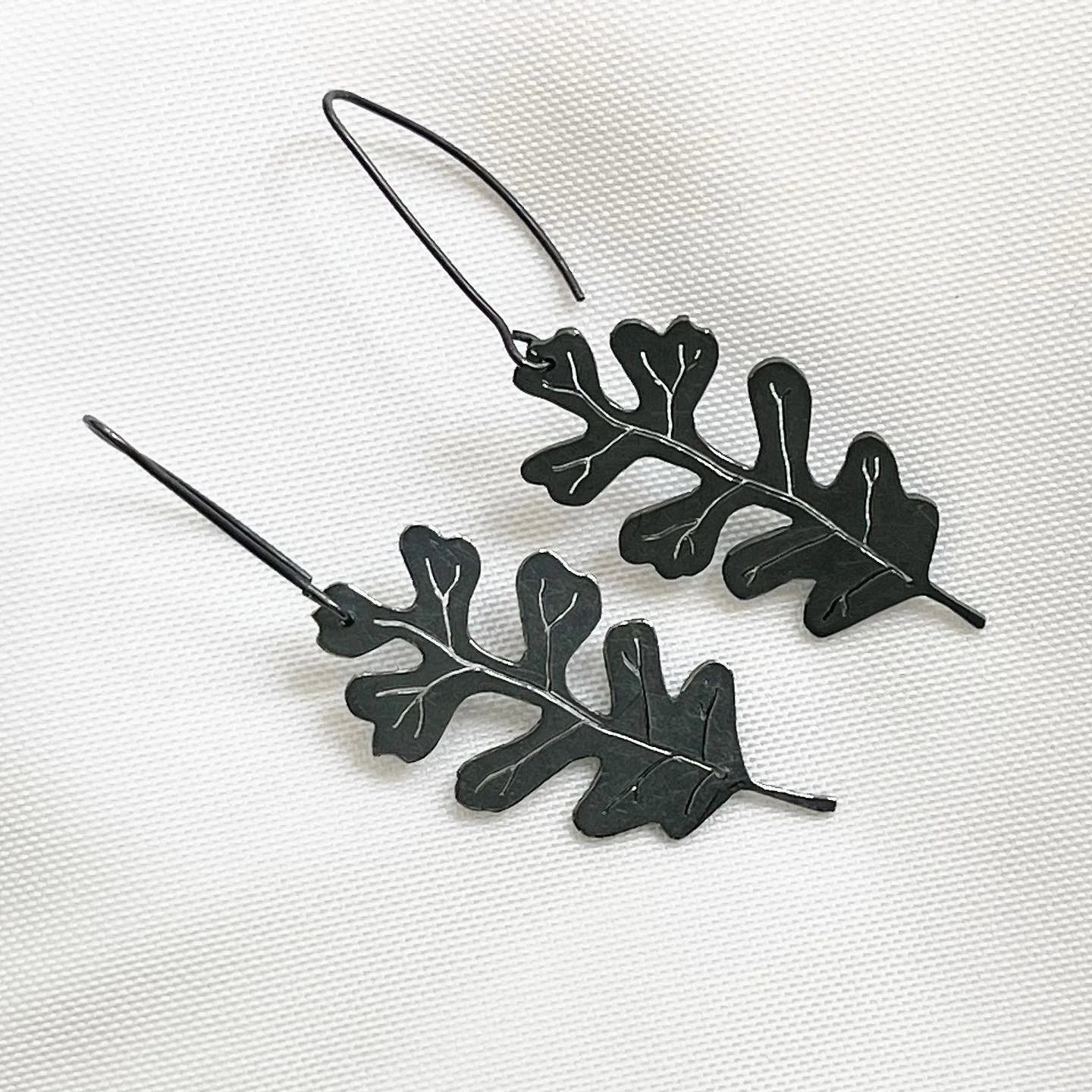 Oak Leaf: it is said to represent WISDOM, STRENGTH and ENDURANCE.  I did not know this while making my series of oak leaf pieces.  Oddly enough, these three attributes align with my current season of life. 

These large Oak Leaf earrings are a little