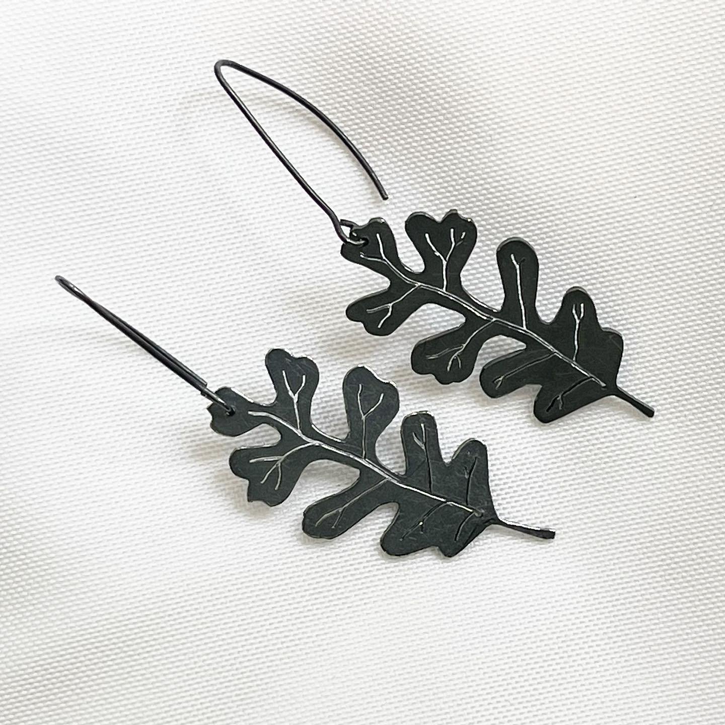 Oak Leaf: it is said to represent WISDOM, STRENGTH and ENDURANCE.  I did not know this while making my series of oak leaf pieces.  Oddly enough, these three attributes align with my current season of life. 

These large Oak Leaf earrings are a little