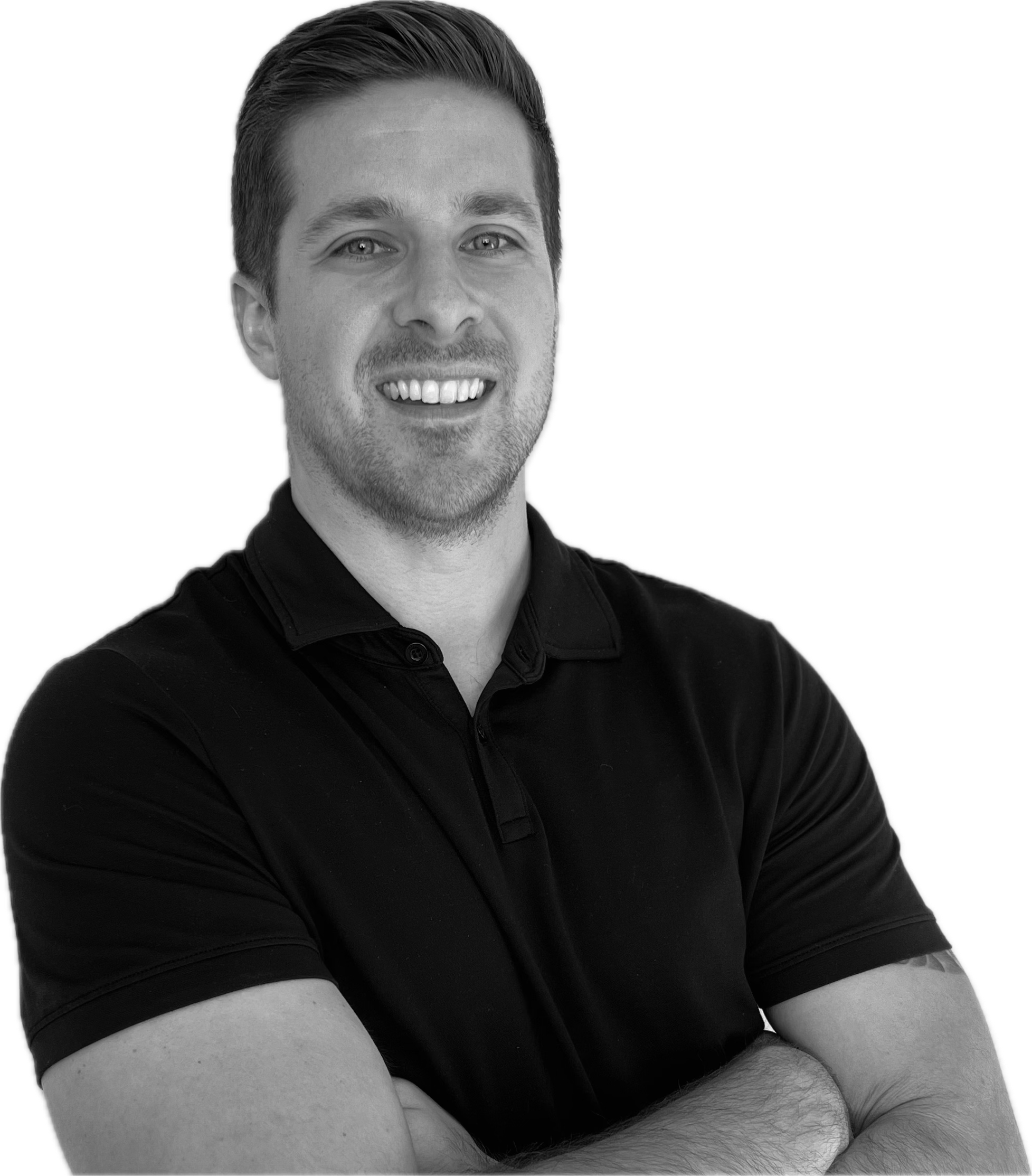 Black and white portrait of a smiling man with crossed arms, wearing a polo shirt.