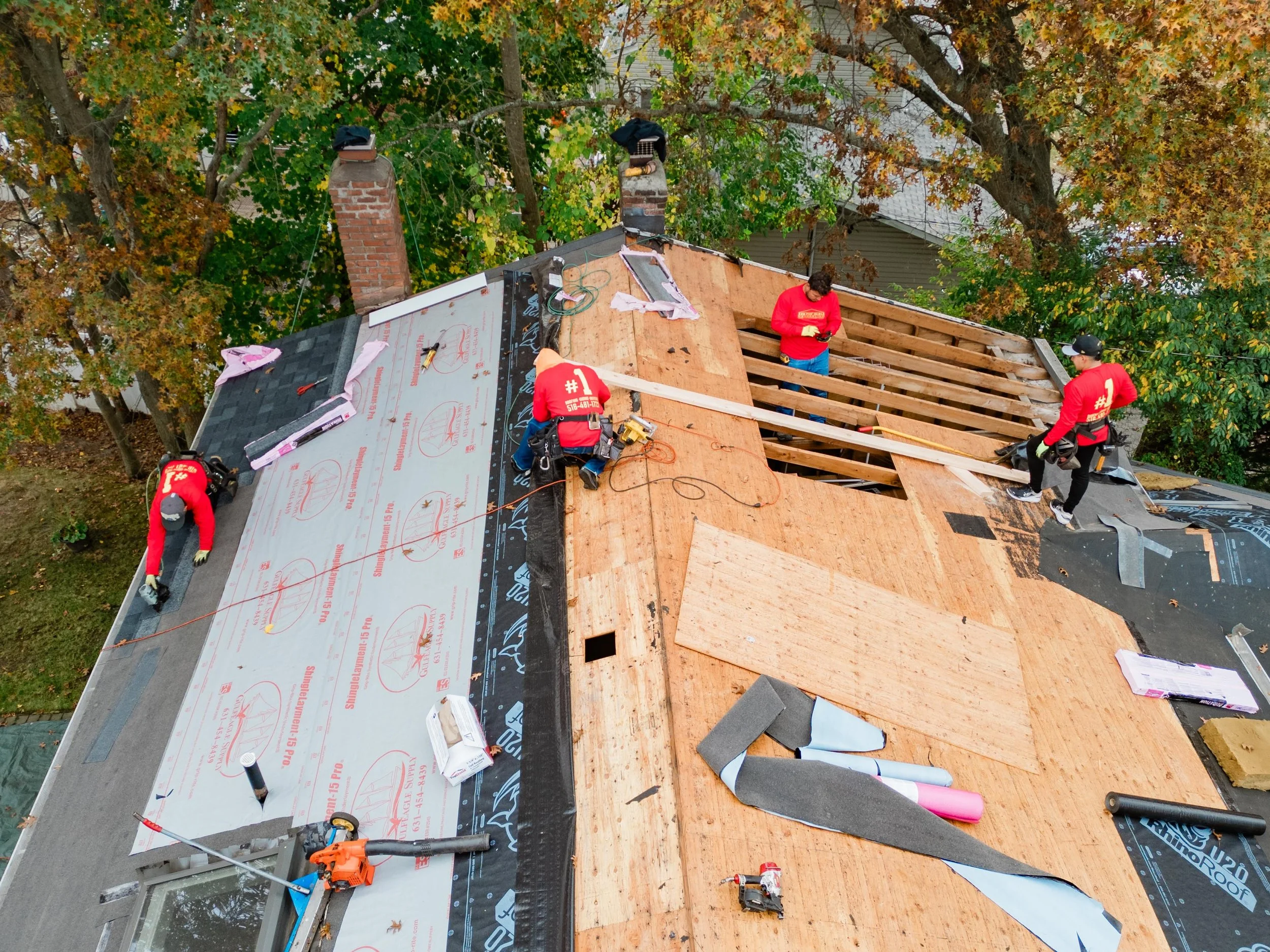 Responsible Remodeling Workers Updating Residential Roof