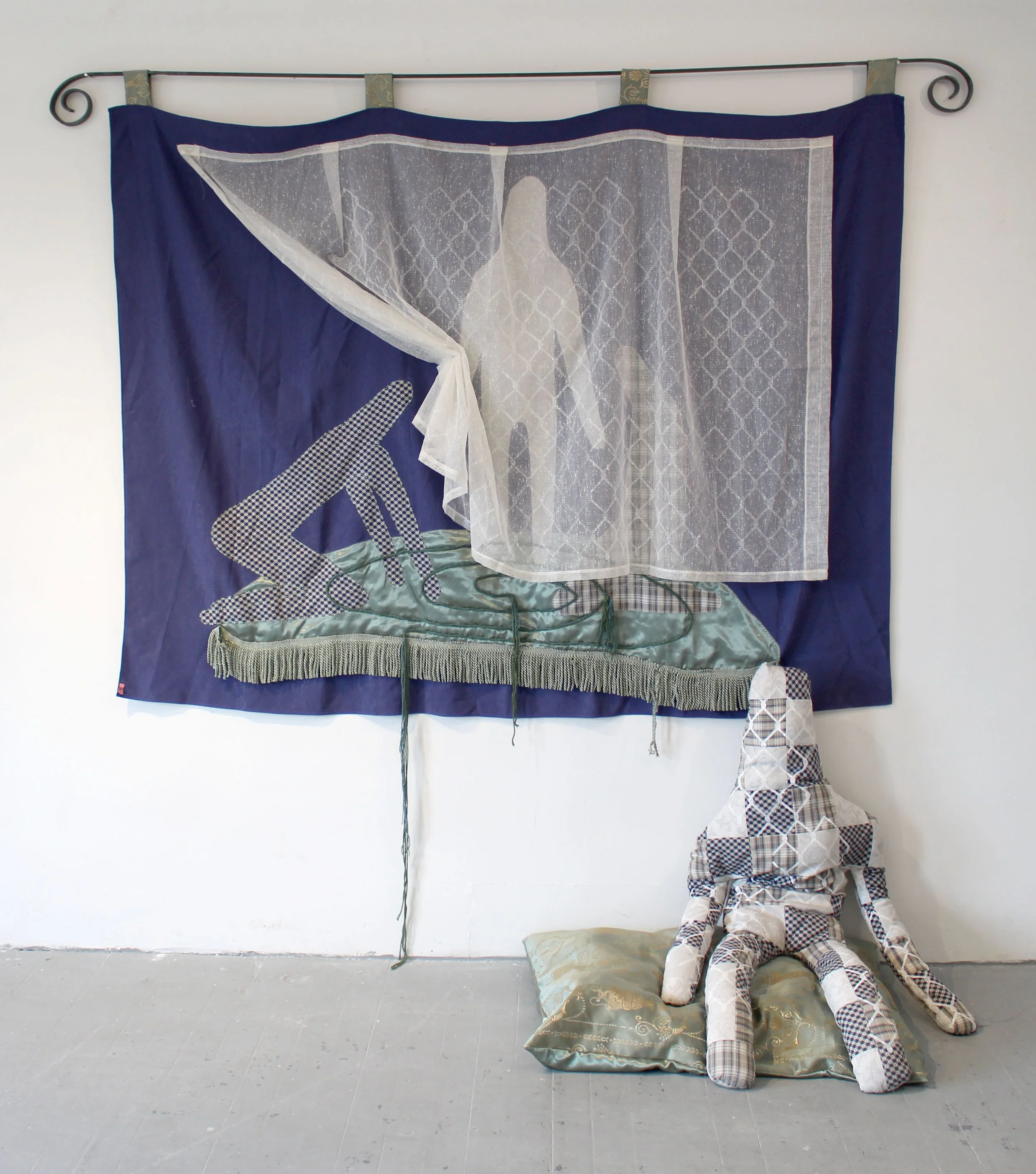 "Submit to the Pattern", found fabric, embroidery, screen print, wrought iron, wool yarn, rope making, polyfil, rice, 32" x 80" x 30", 2025