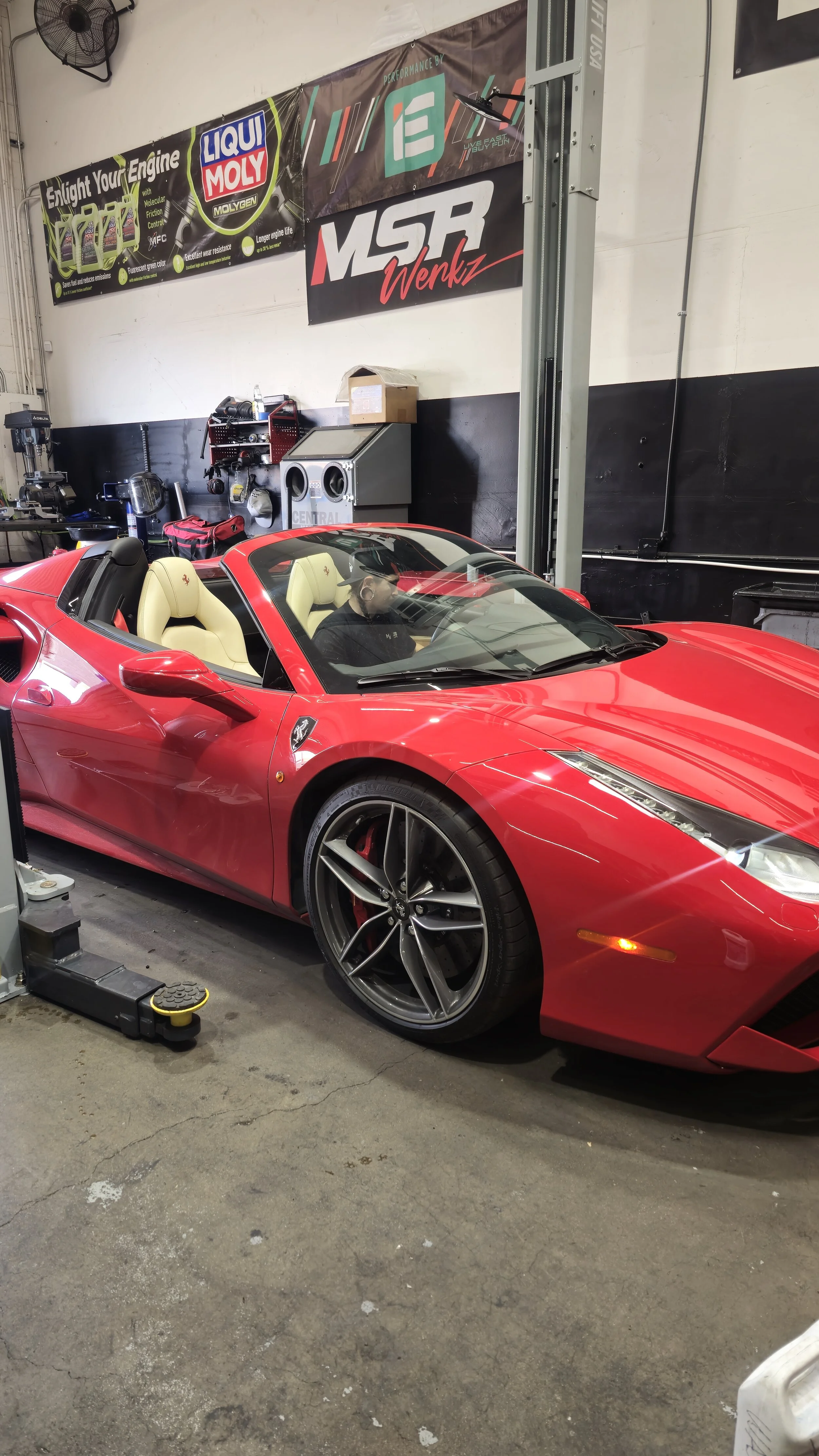 A beautiful red Ferrari getting a full fluid service and inspection at Haus of Euro in Tempe.