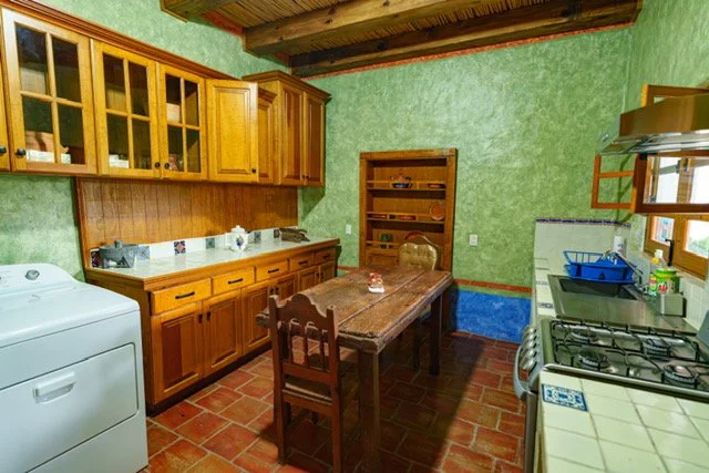 Our property features a second kitchen conveniently located in the corridor area, fully equipped with everything you need to prepare your meals. For added convenience this space also includes a washer and dryer allowing you to take care of your laund