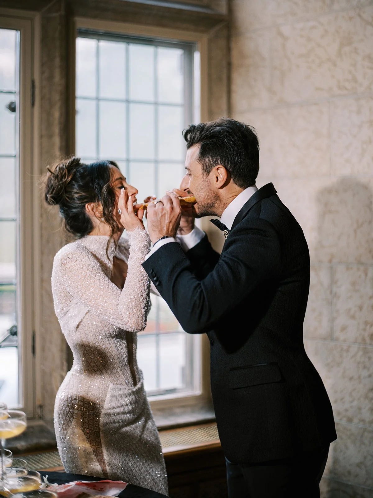 unique cake cutting ideas, bride and groom share a beaver tail at their Canadian wedding at the Fairmont Banff Springs