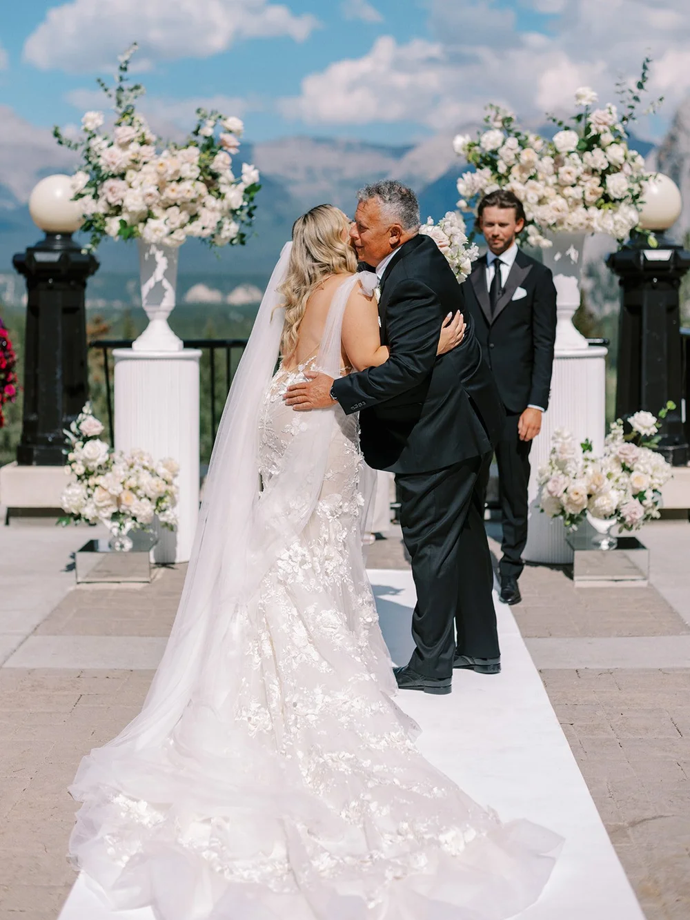 fairmont banff springs terrace ceremony | bride hugging father