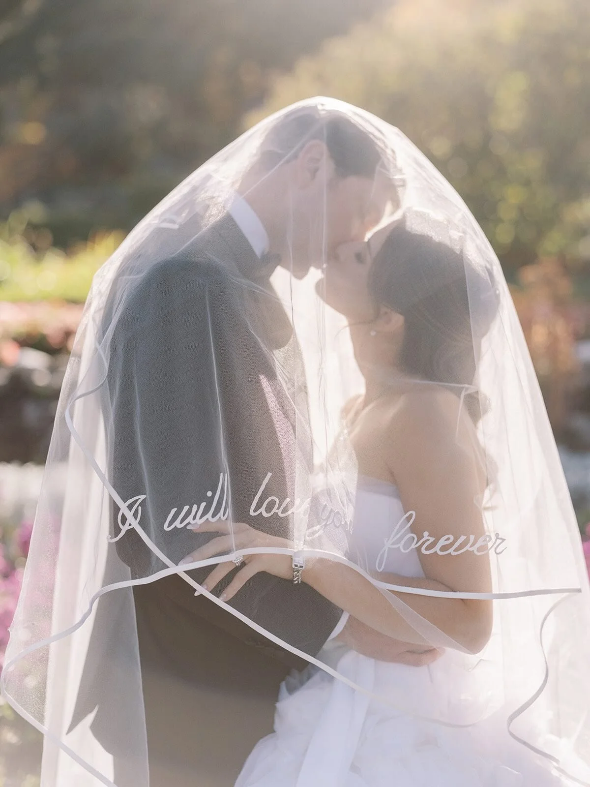When I saw &ldquo;I will love you forever&rdquo; embroidered on this veil I was SO excited. I always love veils, especially with some wind, but this detail was something I had to ensure made it in some photos.⁠
Putting it out there in the universe fo