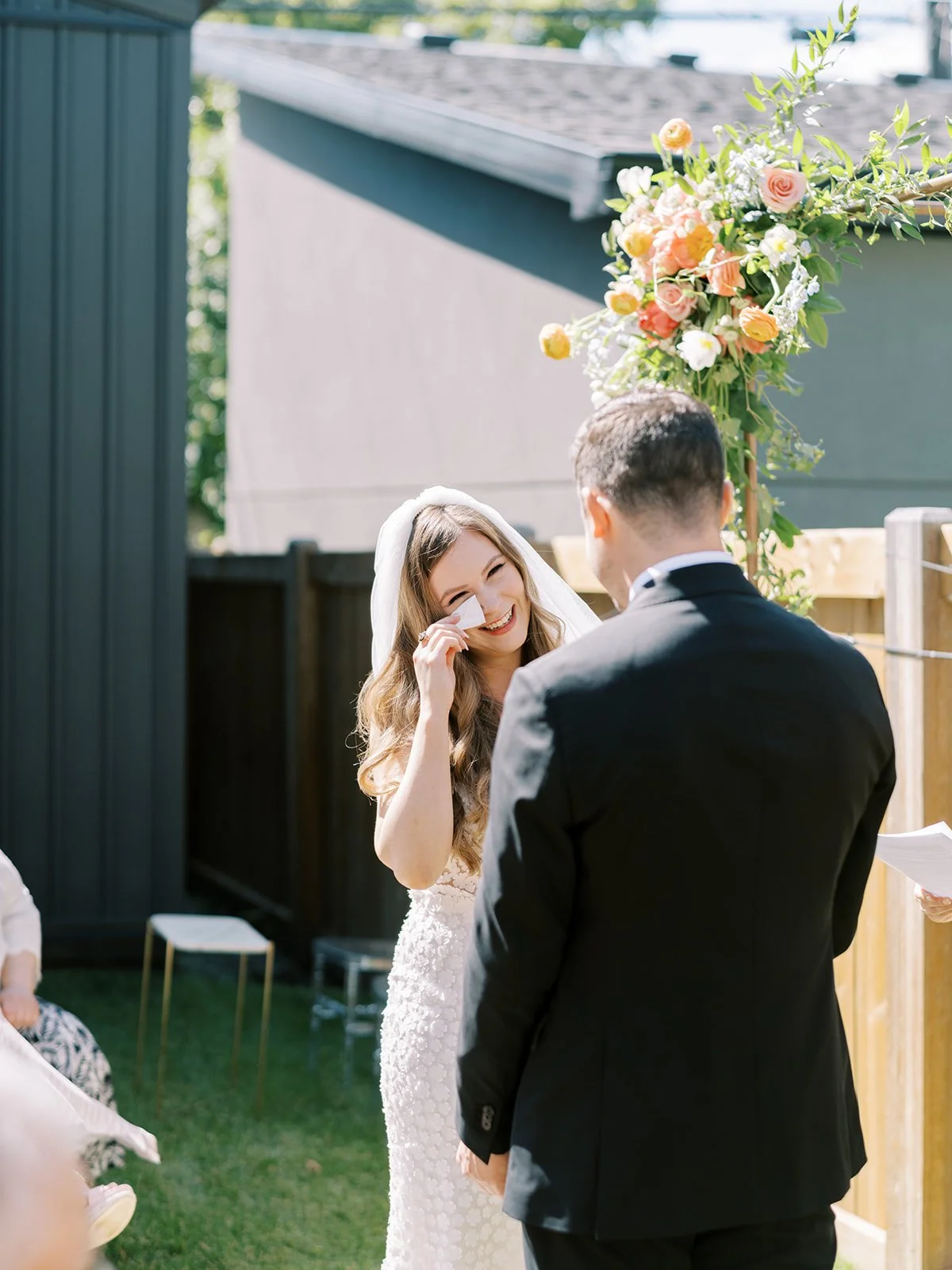 bride crying during vow exchange at Edmonton Backyard wedding