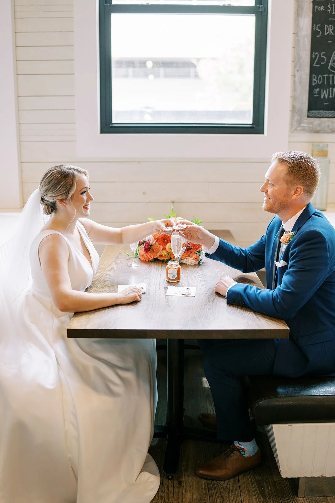bride and groom shooting oysters at calgary wedding