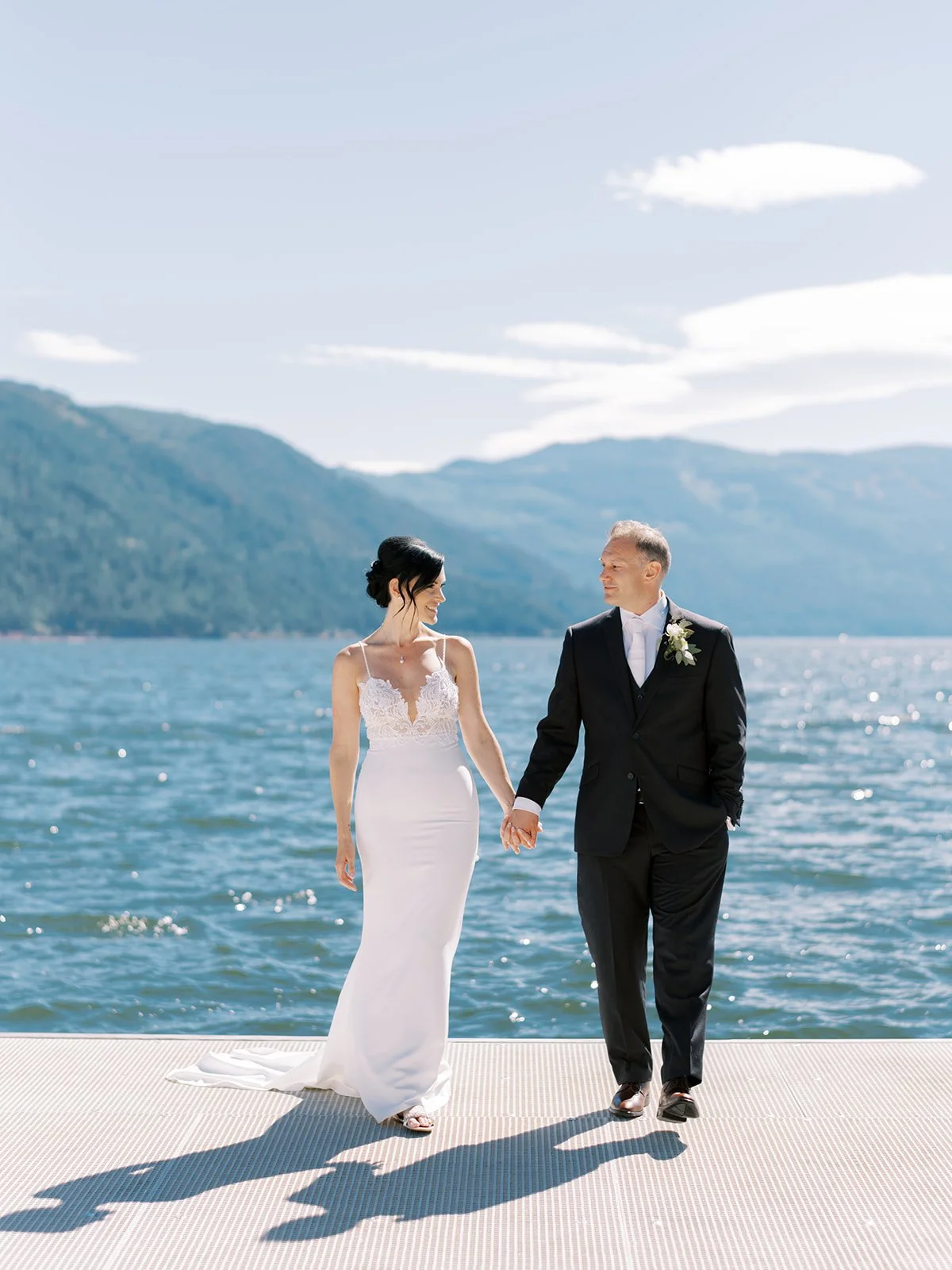 bride and groom portrait with blue lake BC wedding photographer