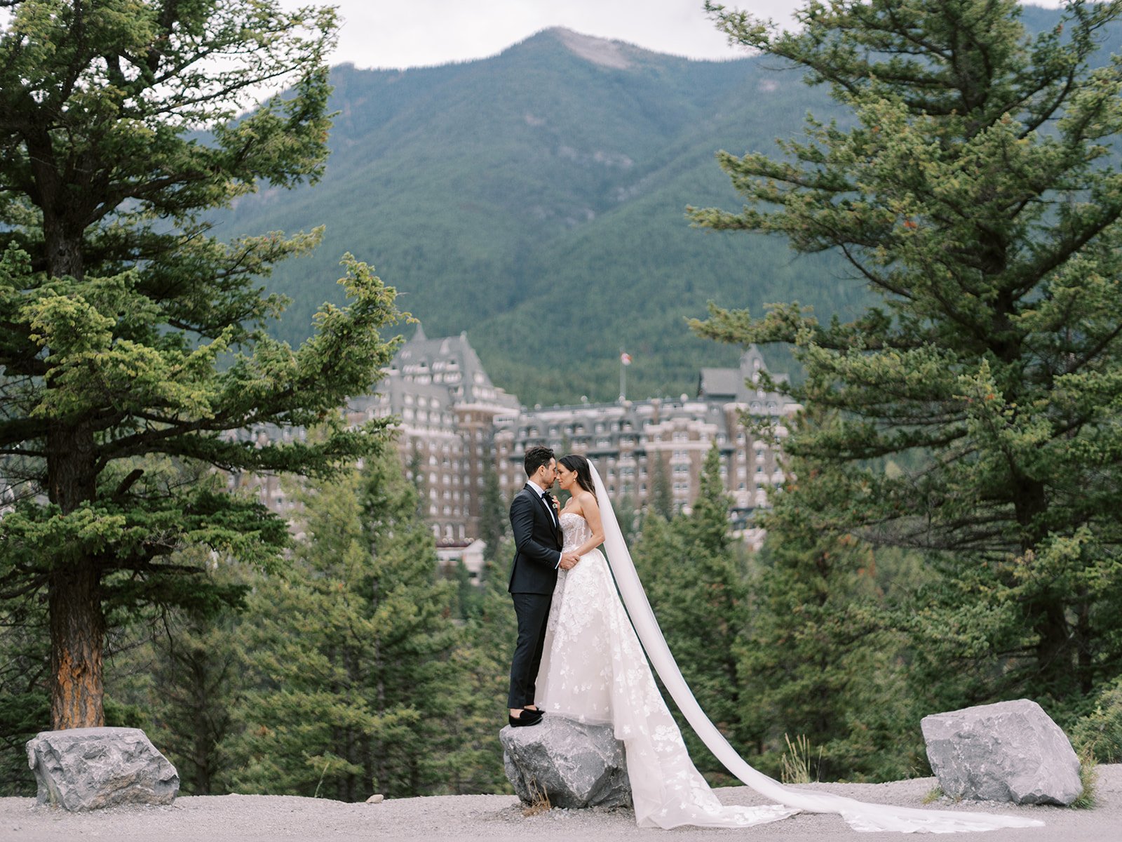 iconic surprise corner overlooks the banff springs hotel for bride and groom photos