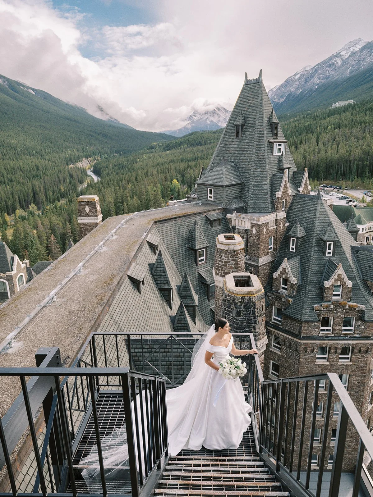 banff springs bride at top of castle overlooking mountain view