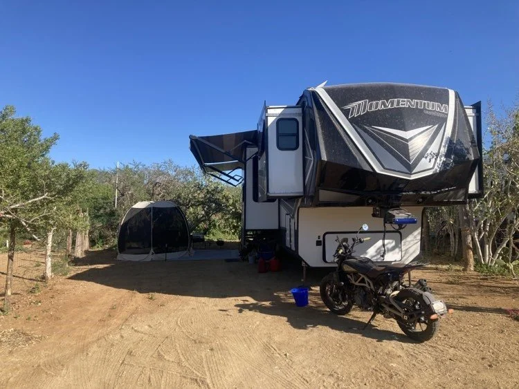 RV parked on a large partial hookup site at Rancho Escondido RV in El Pescadero, Baja California Sur, accommodating rigs up to 45 feet.
