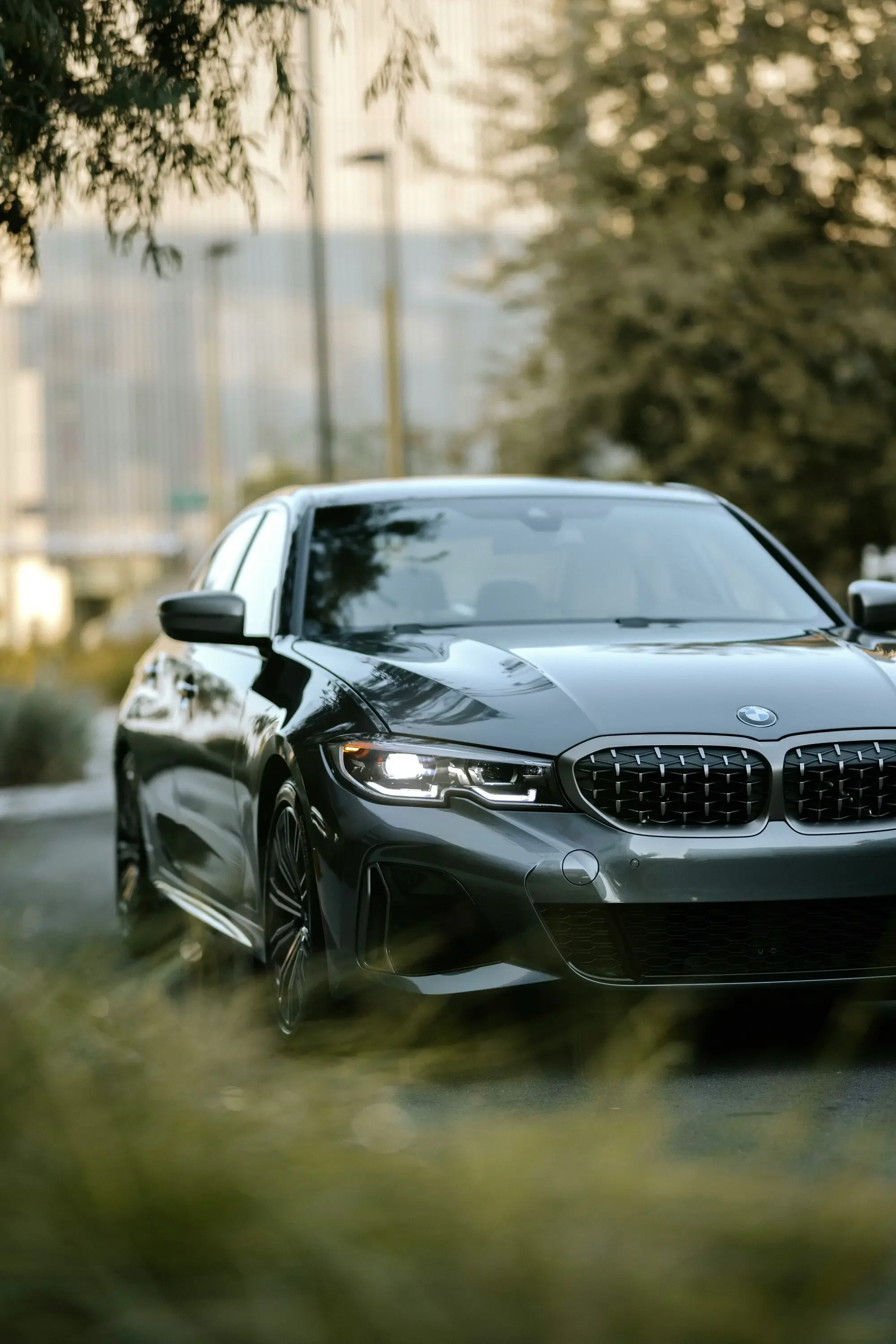 Modern luxury sedan with a clean windshield and professional auto glass service