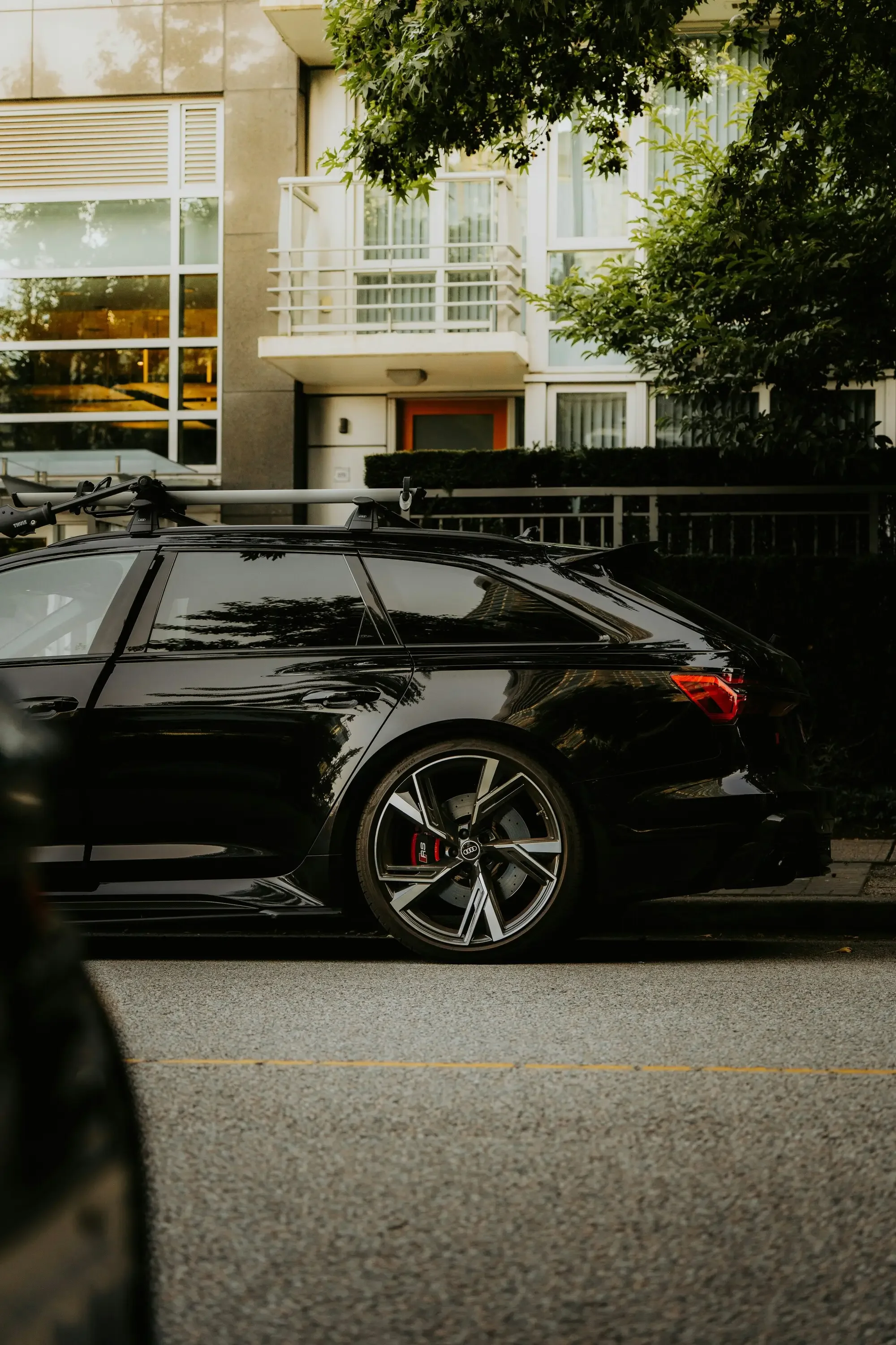 Black Audi with side windows on a San Francisco residential street