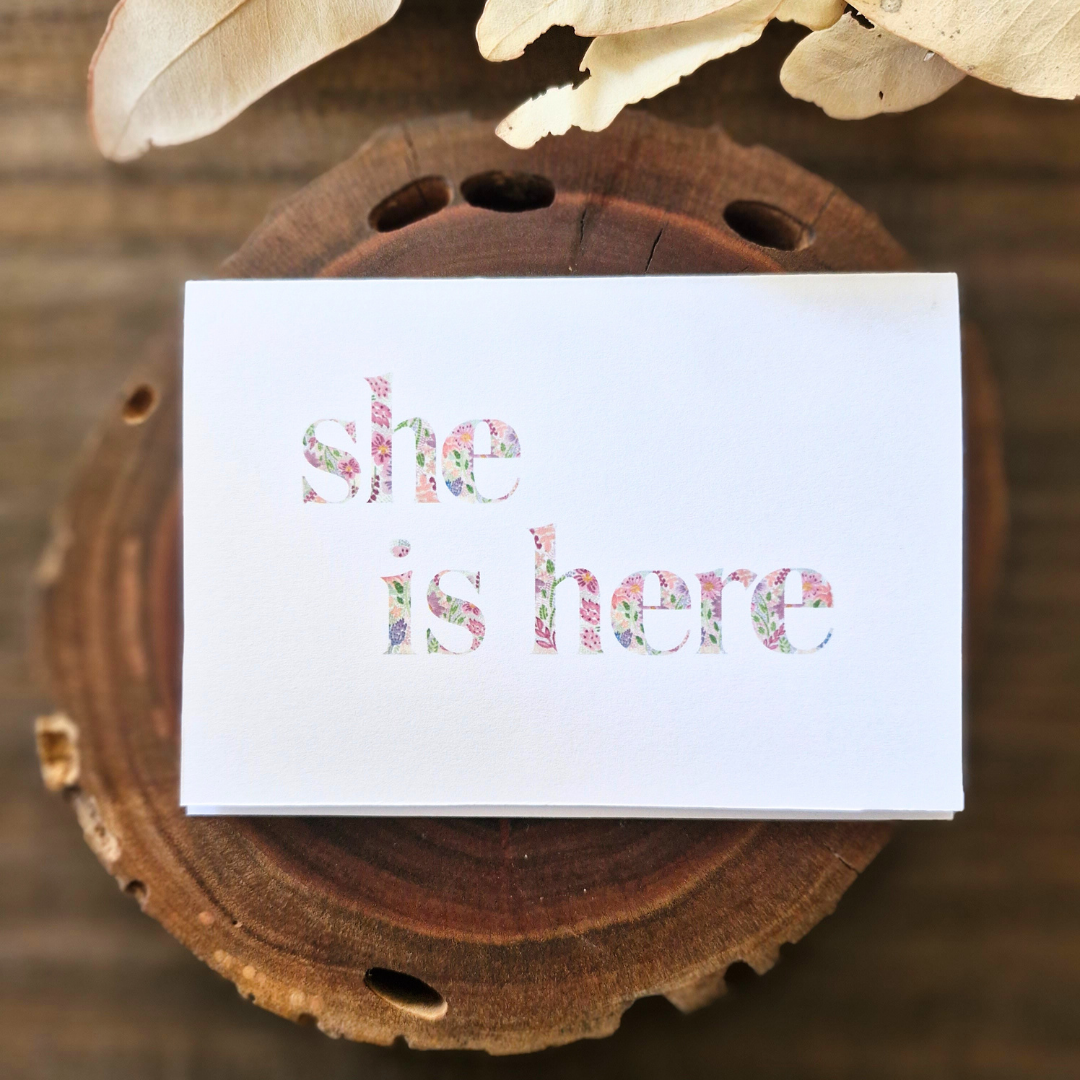 Lettered - she is here.png