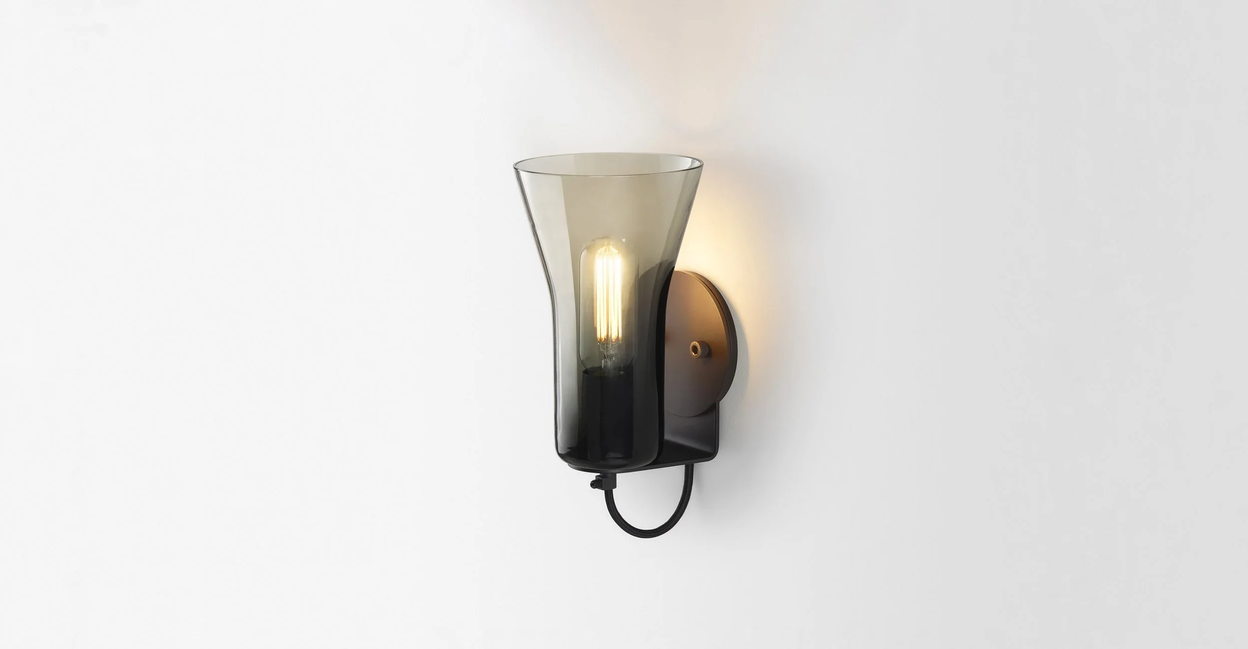 A light grey wall light