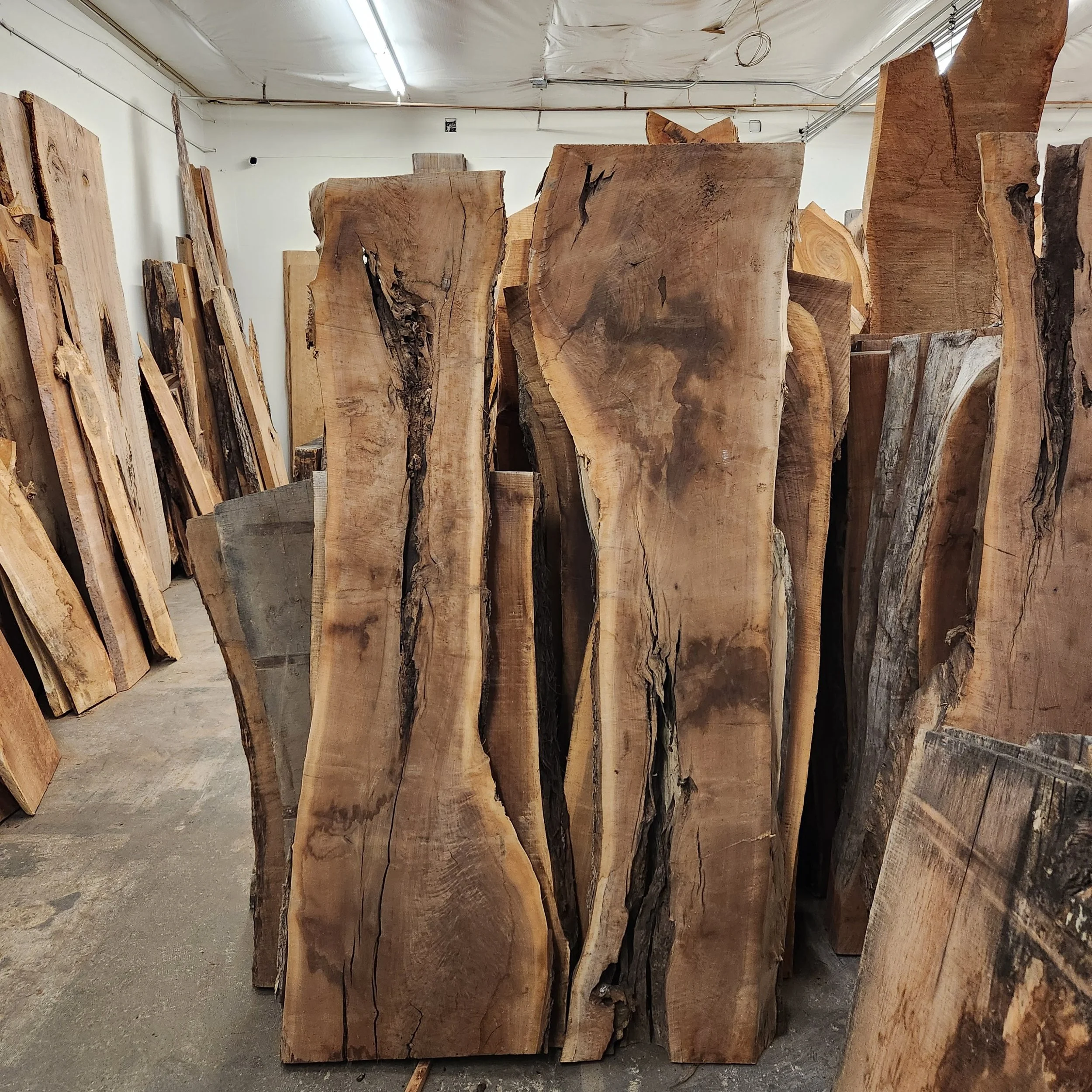 Book matched walnut slabs for a walnut epoxy river table.