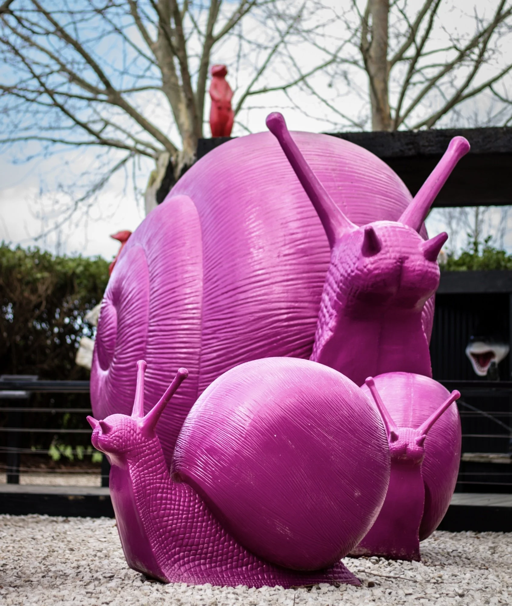 A close-up of a sculpture made from recycled plastic bottles in an art gallery