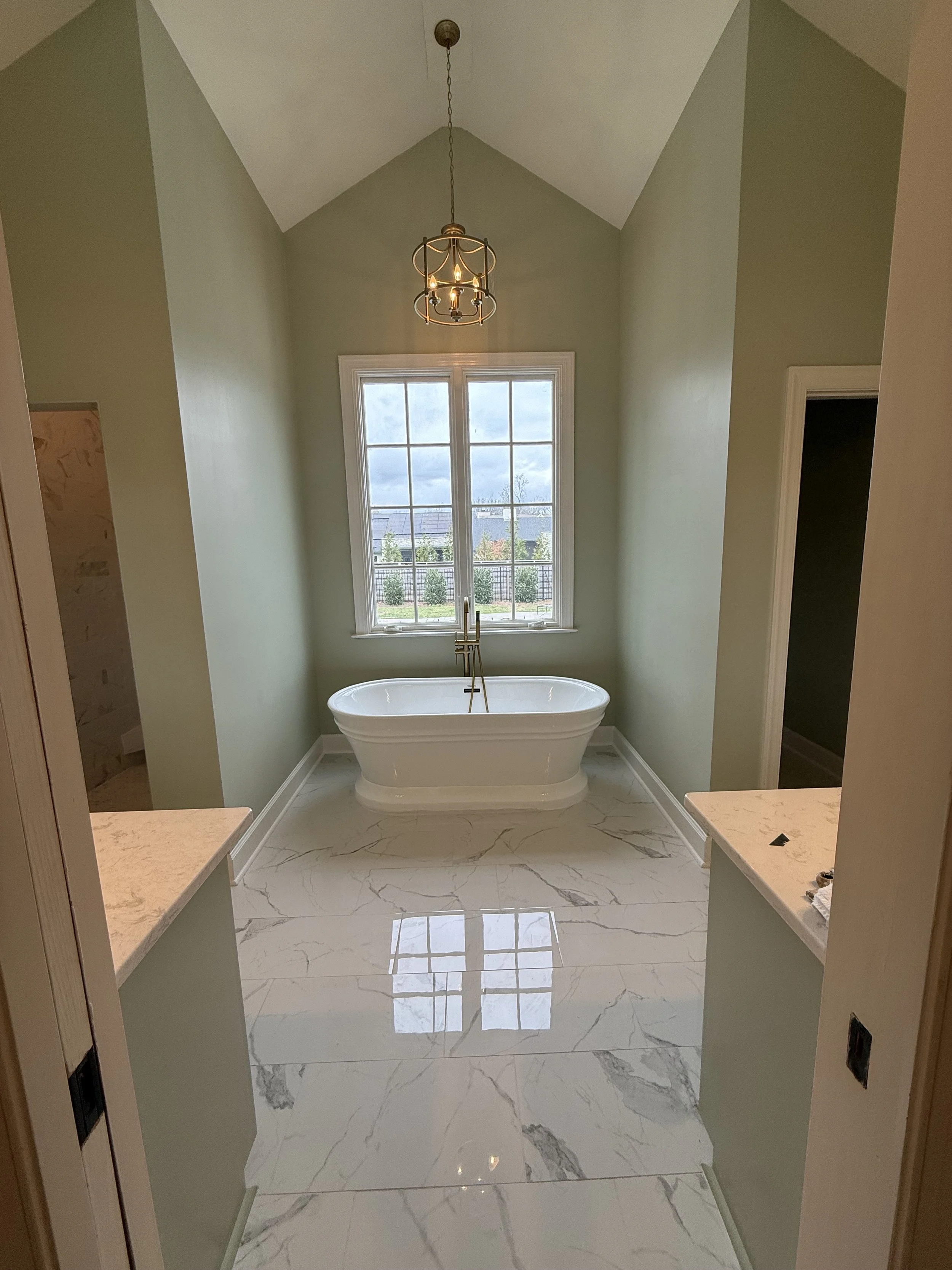 An upgraded lighting fixture and bathtub creates a- Spa-like bathroom experience in Nashville