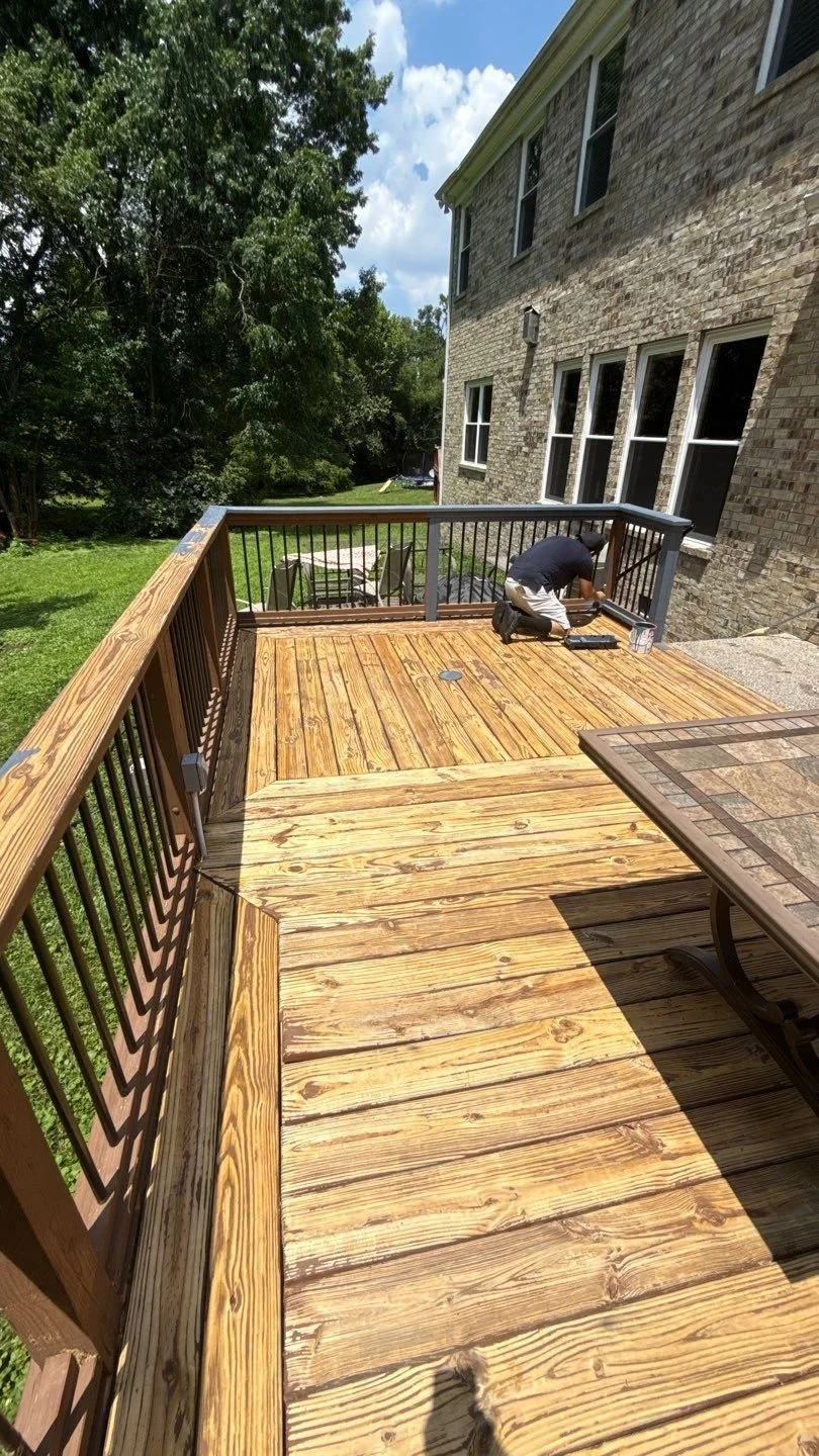 Re-staining and re-painting deck surface