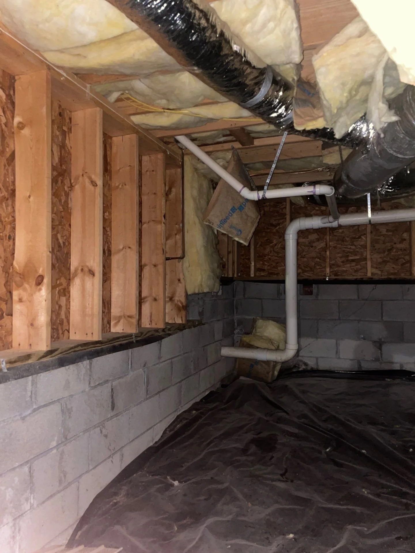 Installed insulation panels on walls, ceiling and flooring at basement