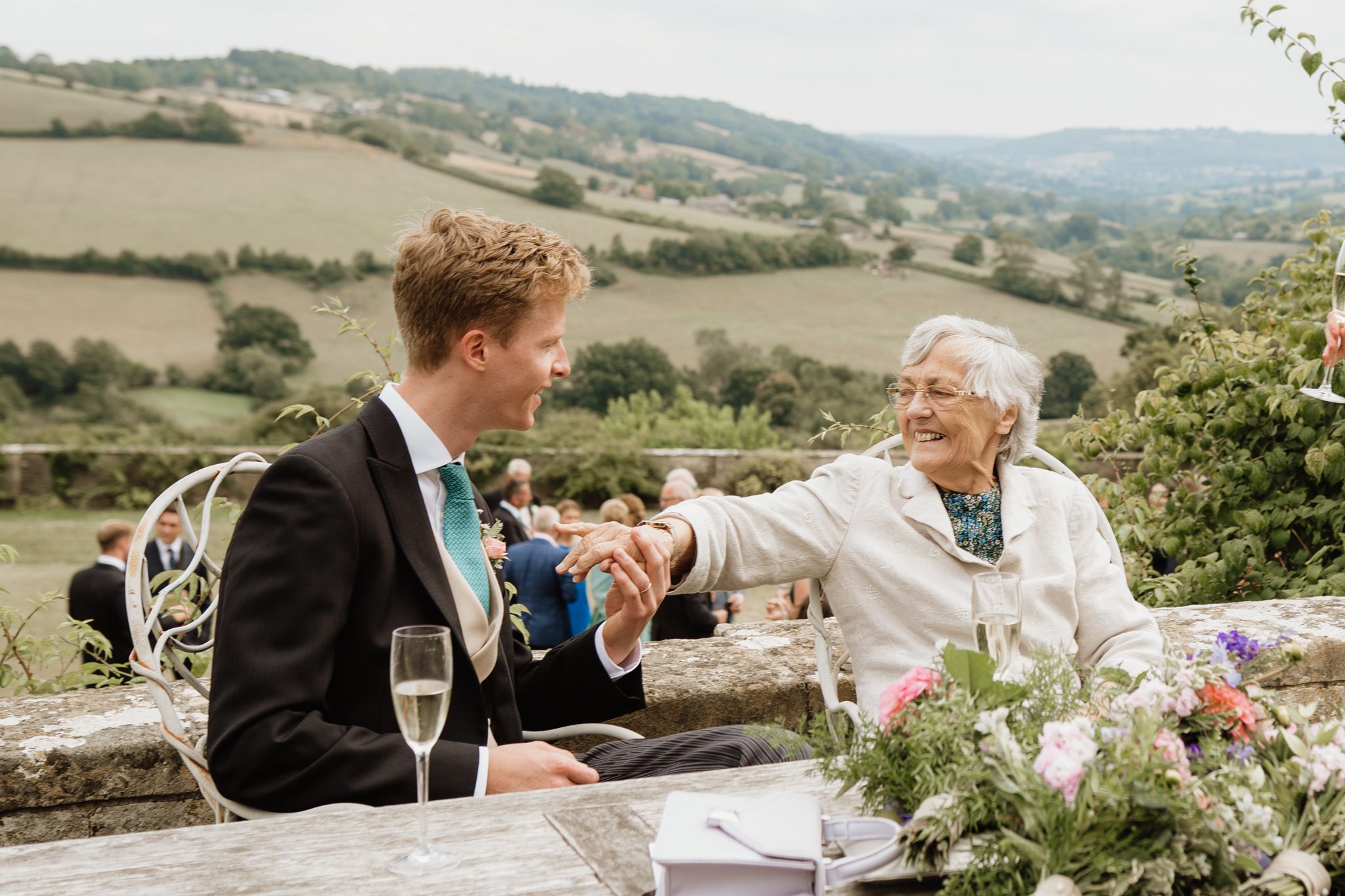 groom's grandma reaching out to touch him