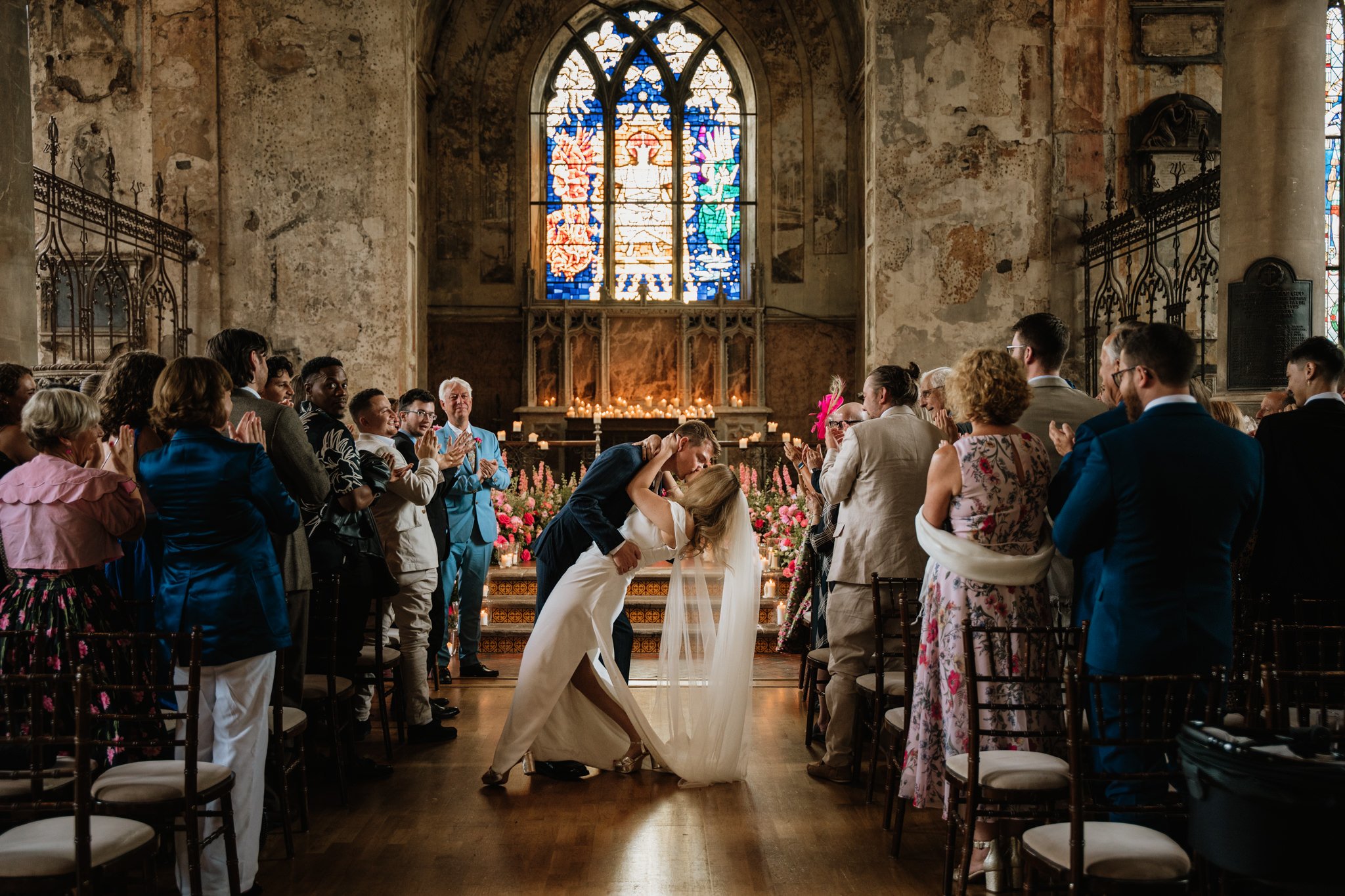 couple kiss in the aisle at the mount without