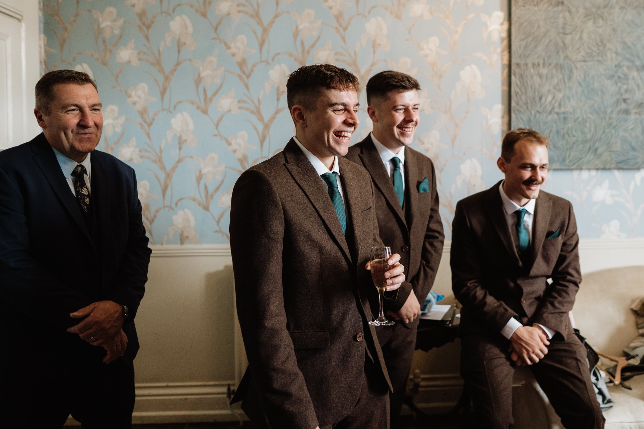 groomsmen laughing candid