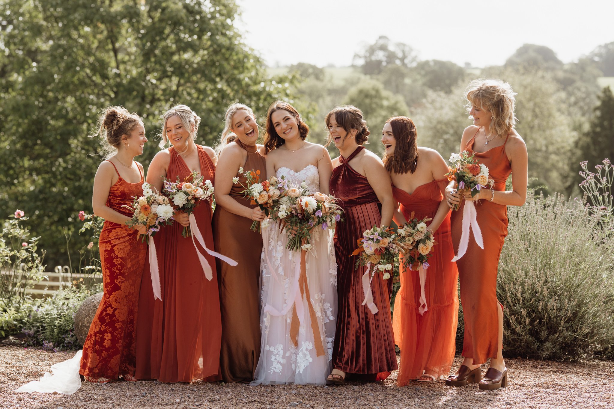 bride laughing with her bridesmaids