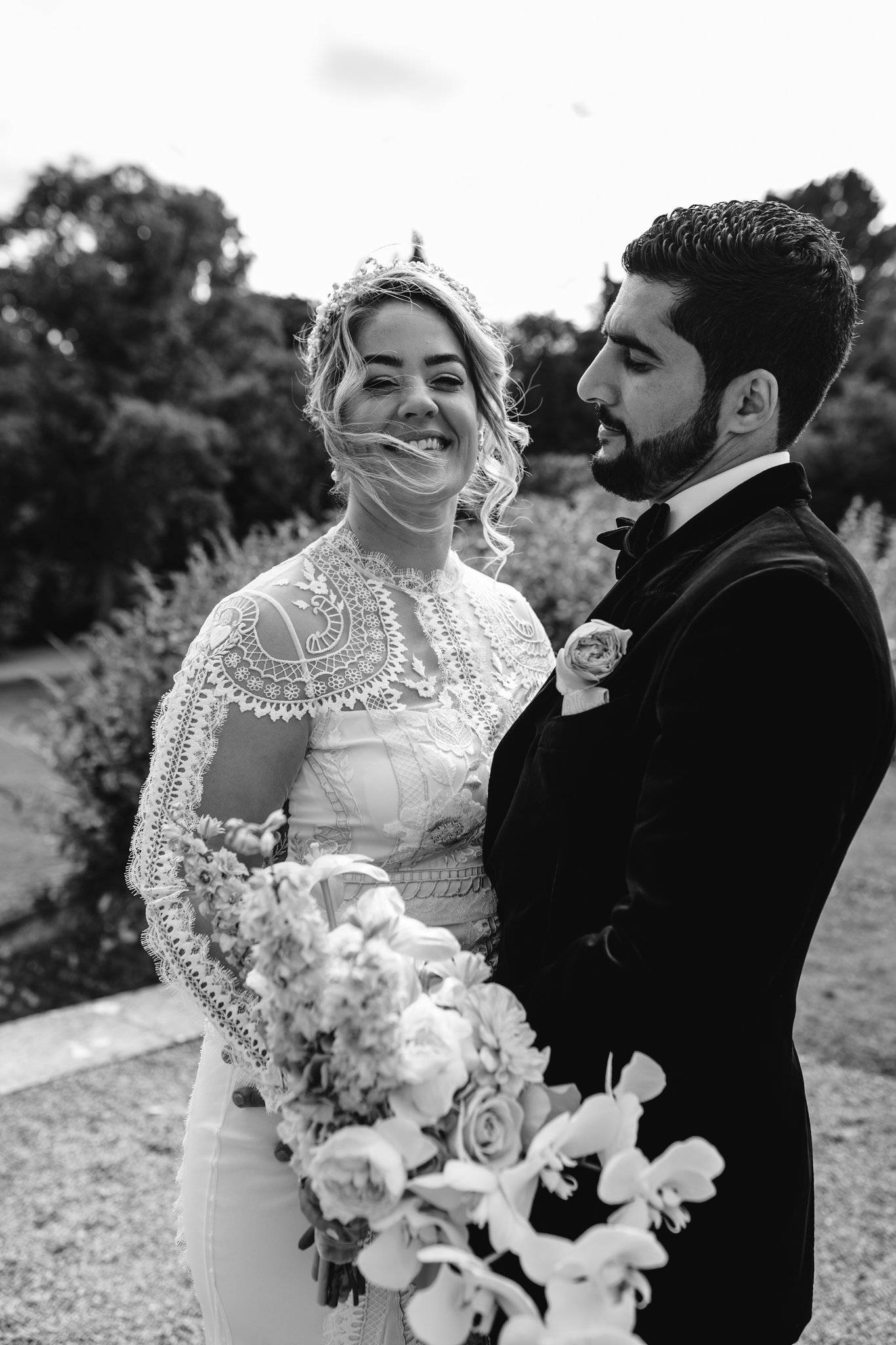 windswept bride laughing with the groom