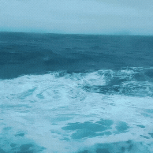 View of ocean water with waves from a boat or ship at sea.