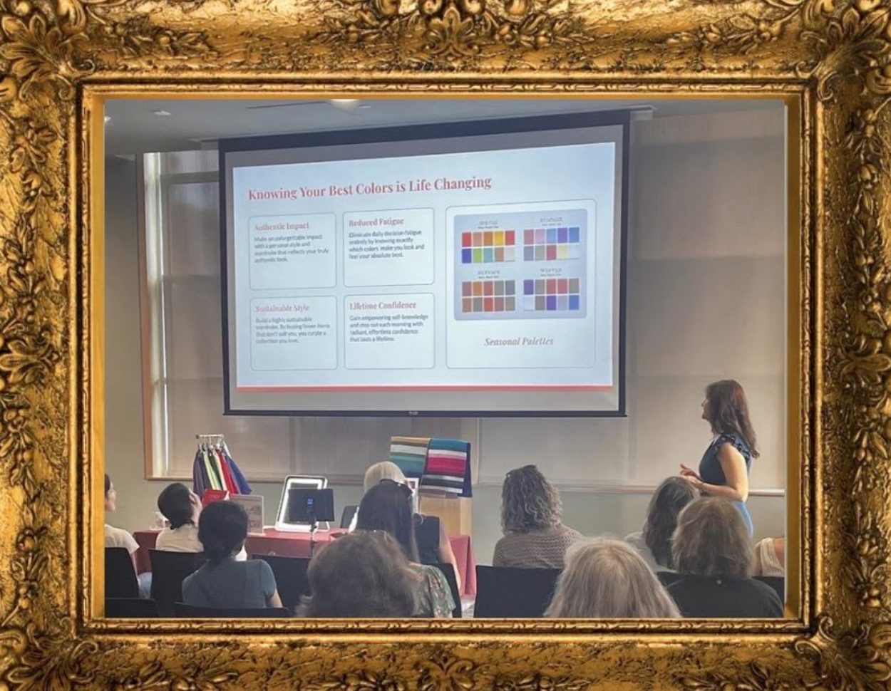 A woman giving a presentation in a conference room, visible through an ornate gold picture frame. The presentation slide on the screen titled 'Knowing Your Best Colors is Life Changing' features color palettes and text about color impact, fatigue reduction, style, and confidence, with a small section labeled 'Seasonal Palettes'.