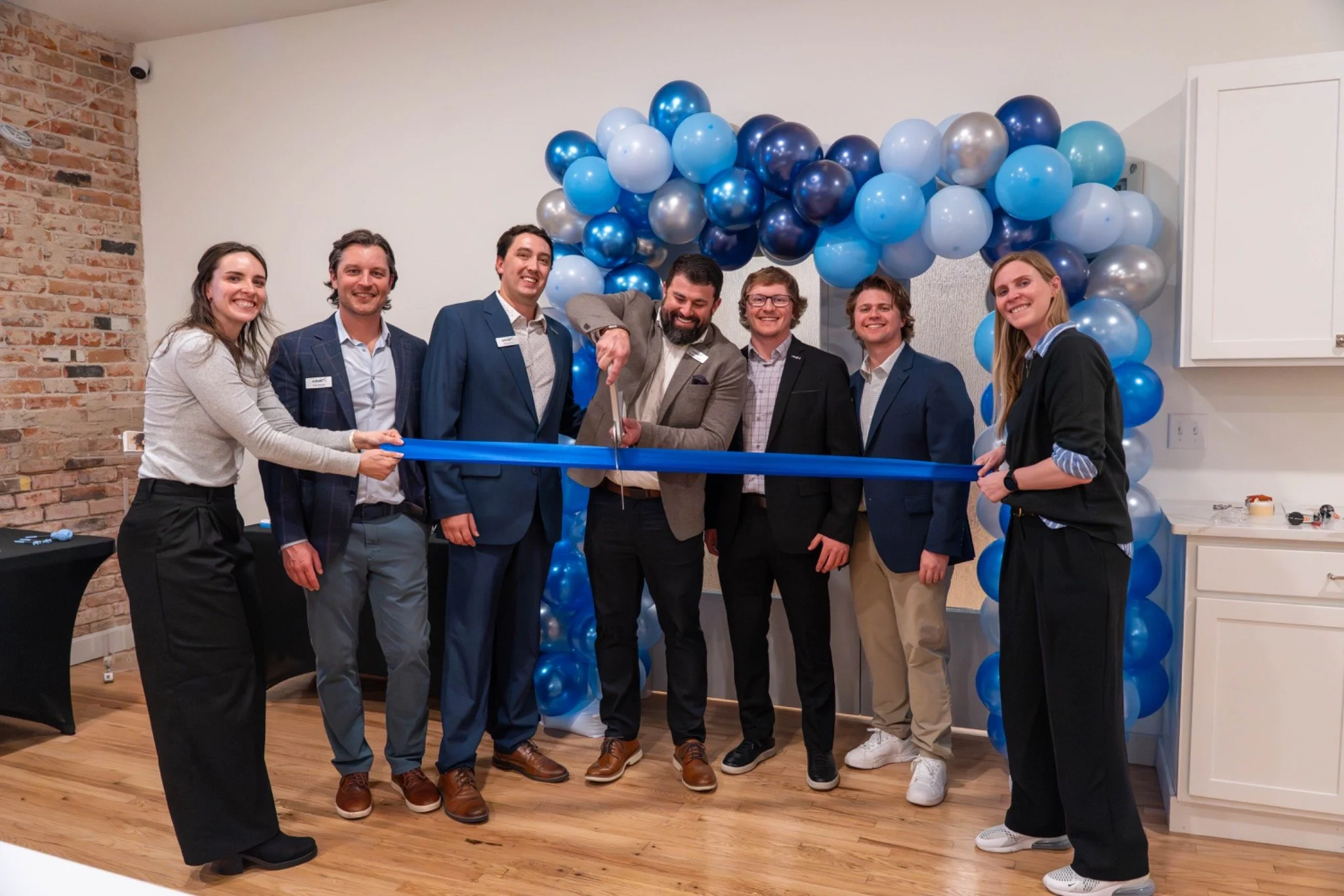 Arthrex Colorado Springs team members celebrating at a ribbon-cutting event