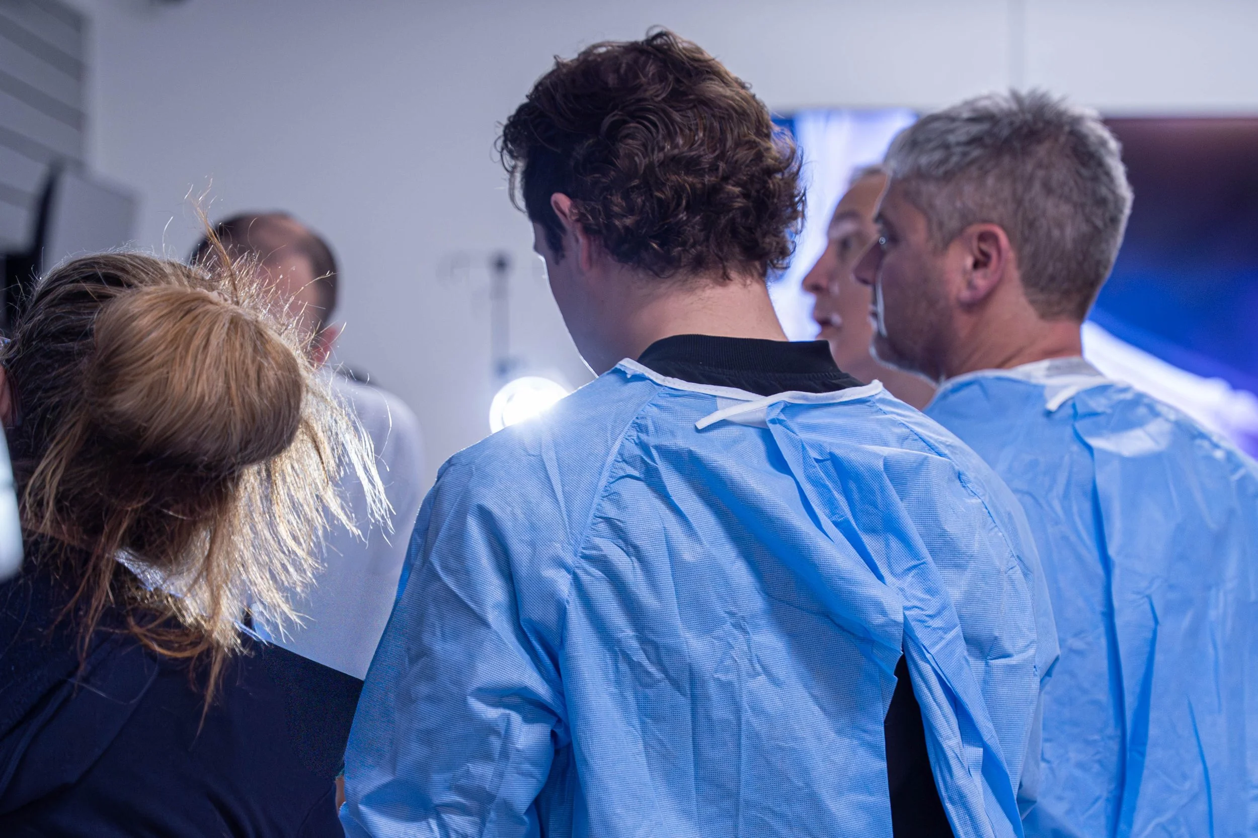 Team members learning together in a medical education lab
