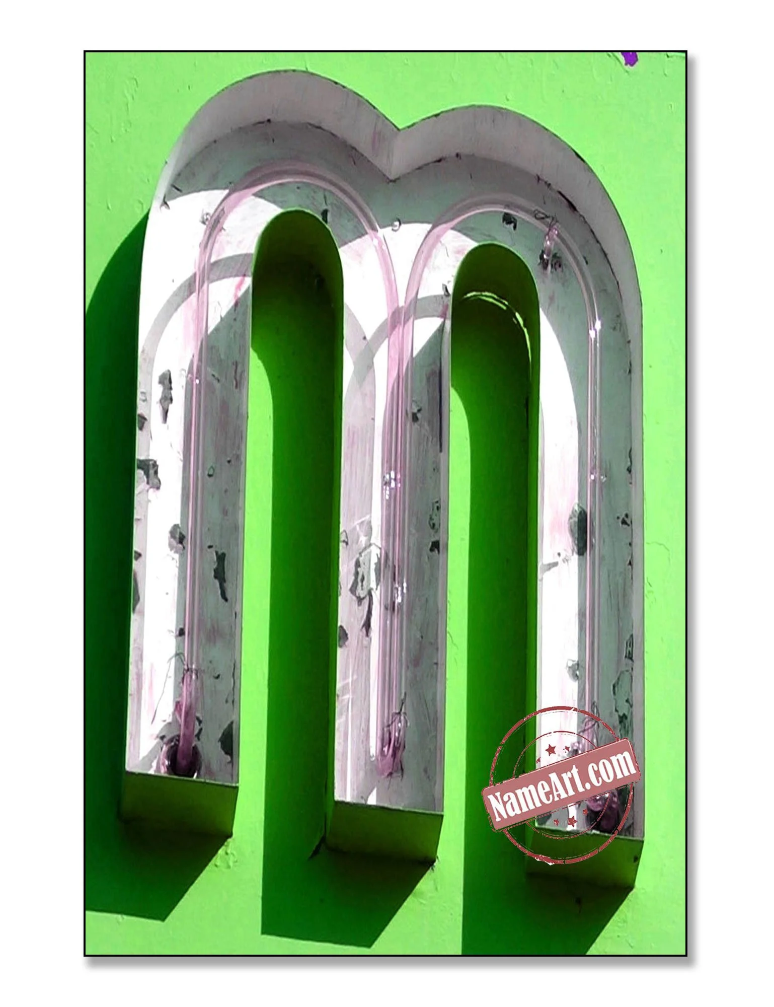 Close-up of a mint green light-up sign with three vertical tubes outlined in clear plastic, mounted on a matching green wall, with shadows cast on the wall.