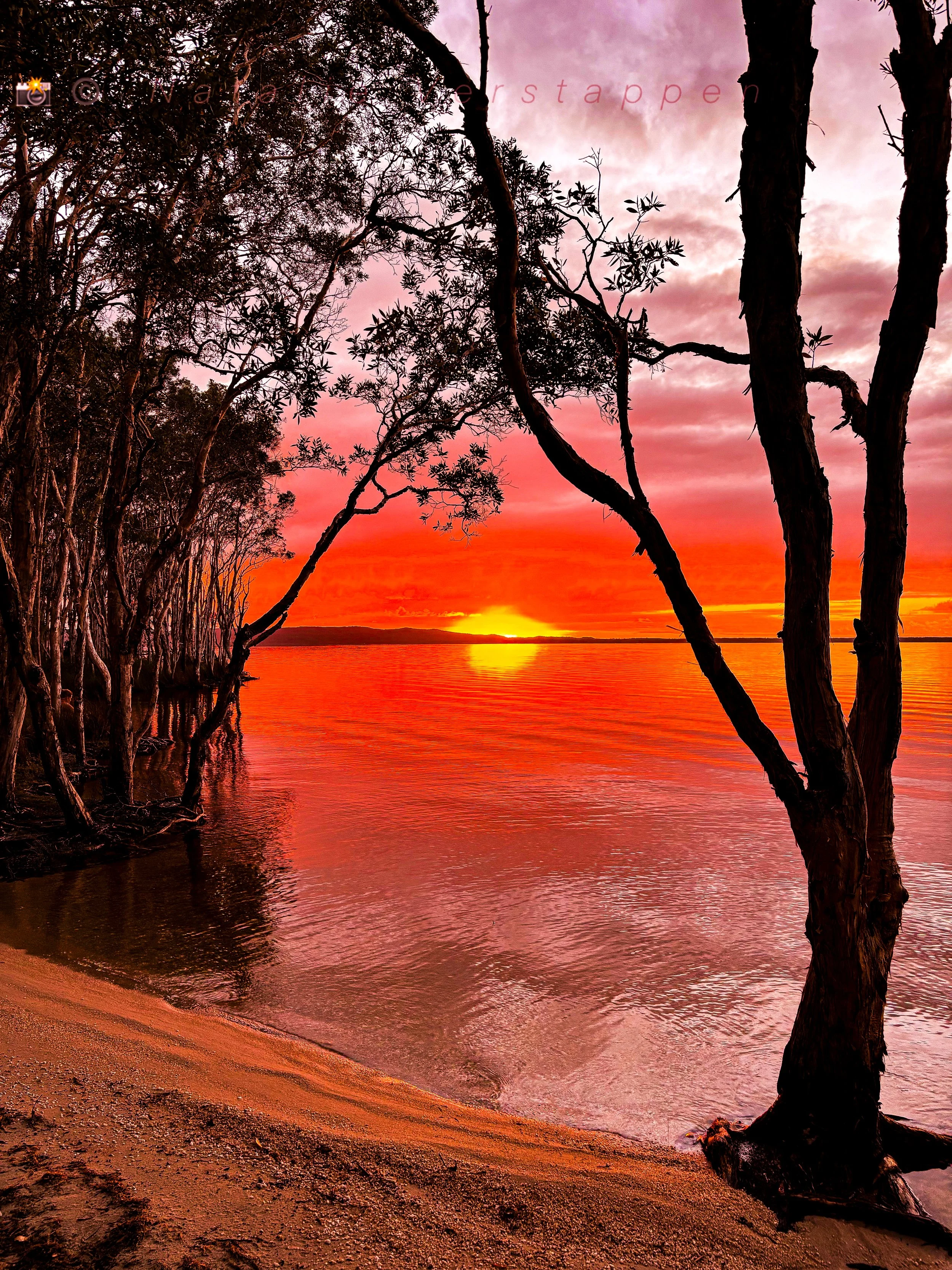 Colorful orange sun rise reflecting 