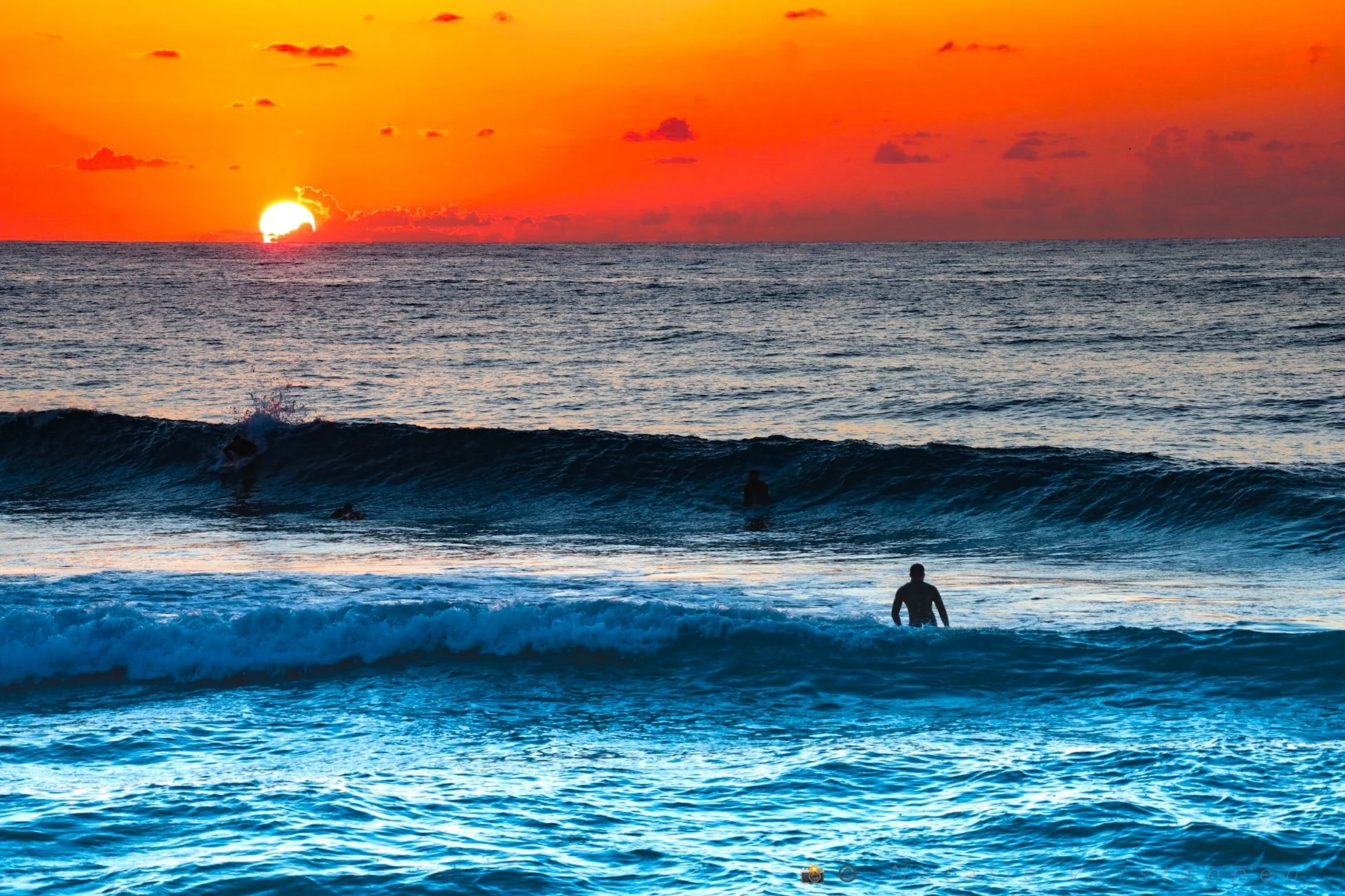 Walking into the ocean at golden hour