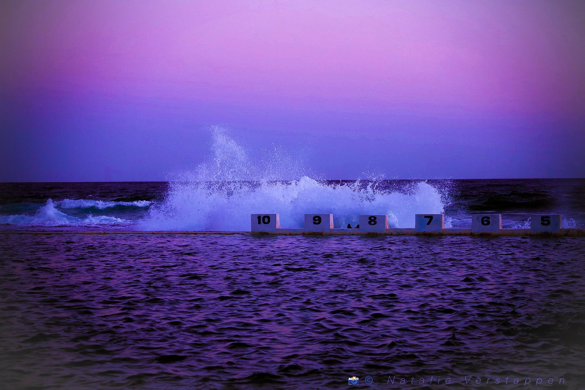 Blue hour, natural pool, waves crashing up