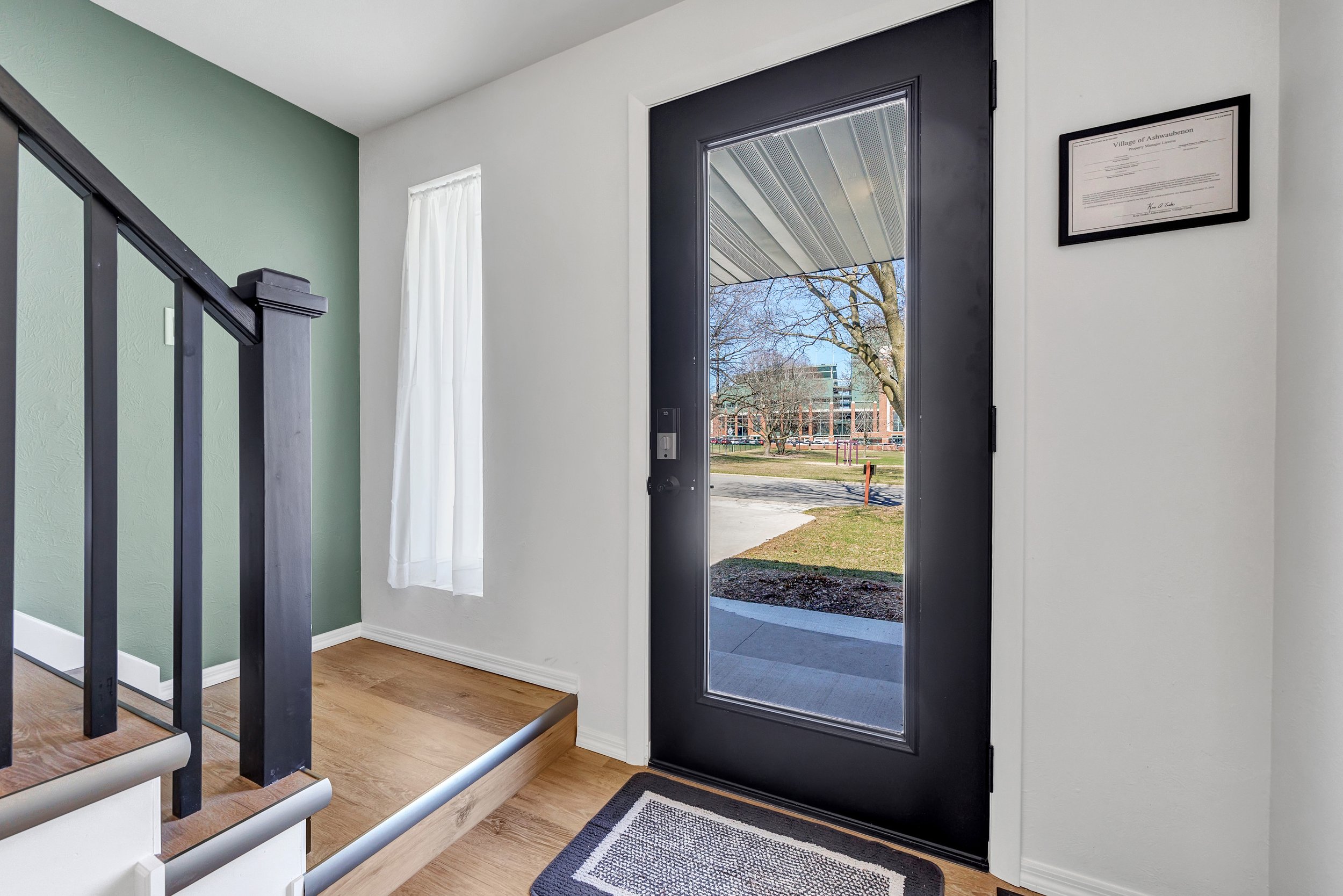 Copy of 1-Front door from inside w Lambeau.jpg